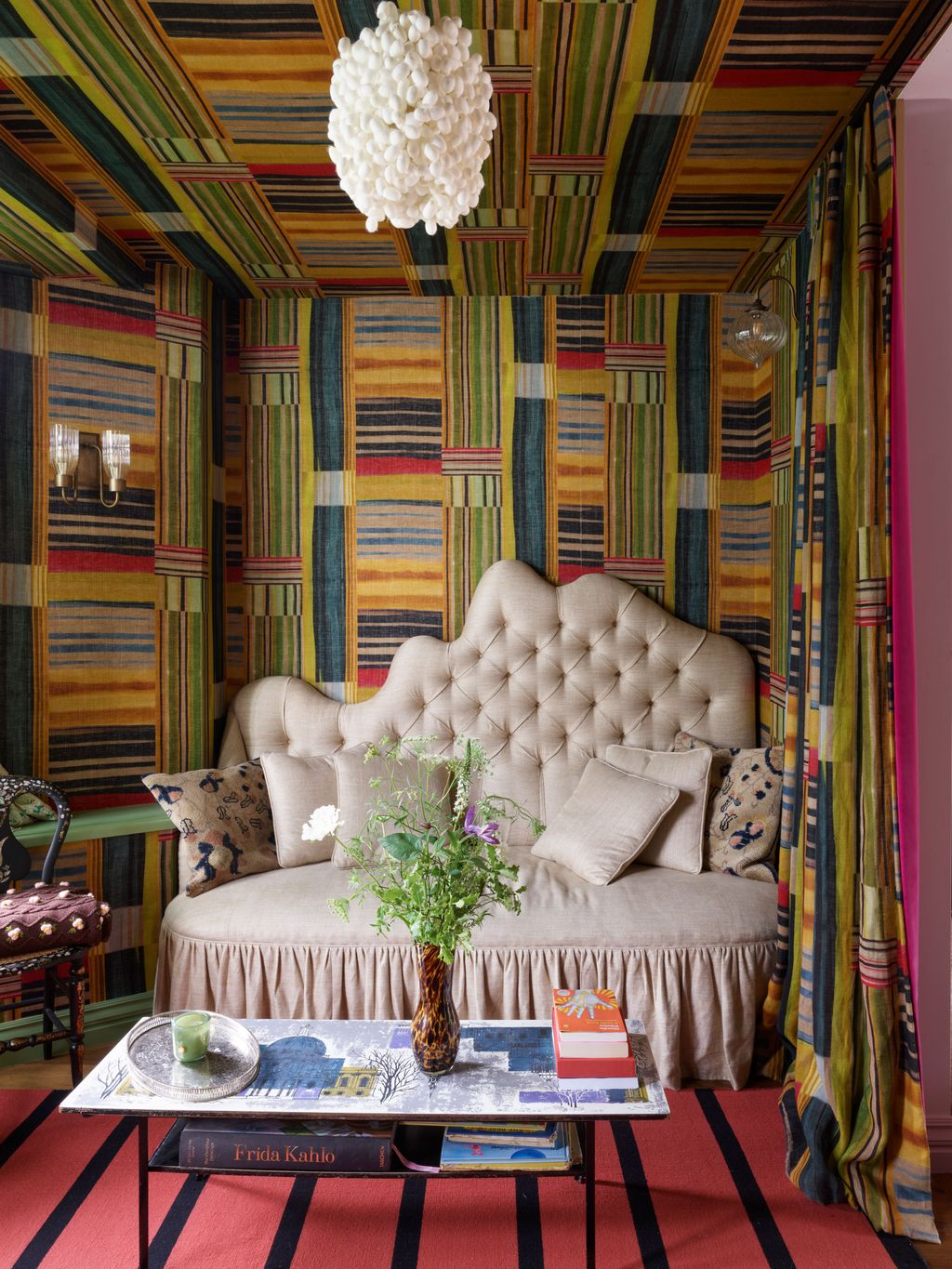 Image may contain Indoors Interior Design Architecture Building Furniture Living Room Room Couch Chair and Book