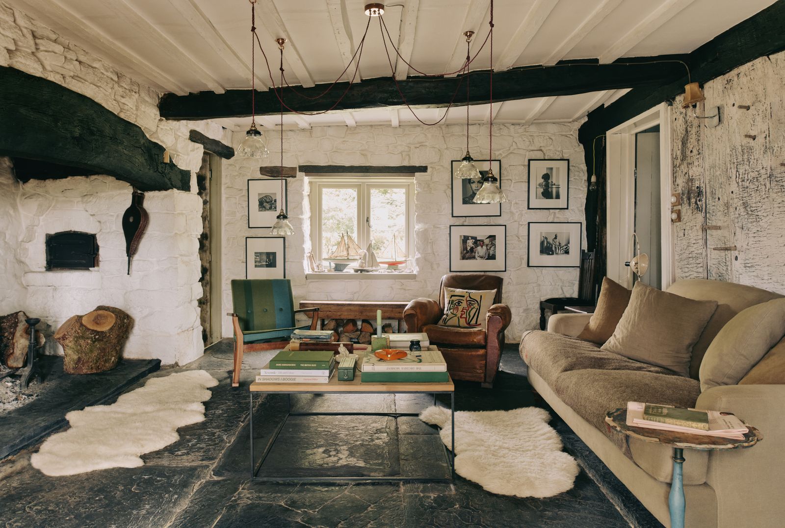 Image may contain Home Decor Architecture Building Furniture Indoors Living Room Room Couch Rug Art and Painting