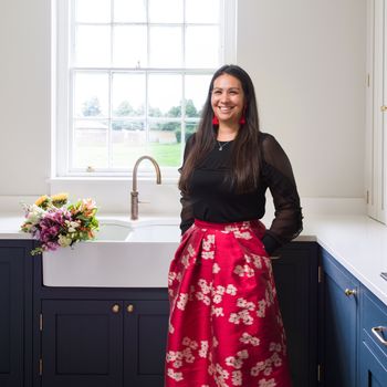 Image may contain: Adult, Person, Flower, Flower Arrangement, Plant, Accessories, Jewelry, Necklace, and Sink