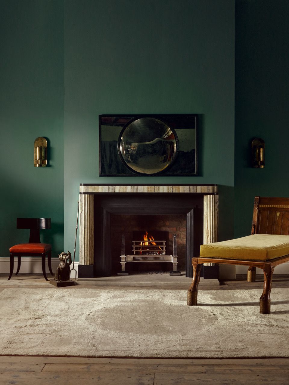 Image may contain Fireplace Indoors Hearth Chair Furniture Lamp Interior Design Home Decor Rug Art and Painting