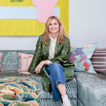 Image may contain: Person, Sitting, Adult, Clothing, Footwear, Shoe, Blonde, Hair, Couch, and Furniture