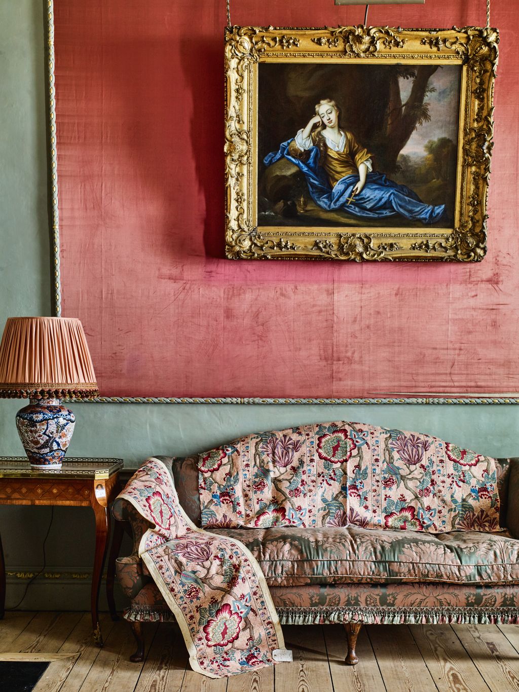 Image may contain Mary Moll Davis Lamp Couch Furniture Art Painting Indoors Interior Design Desk and Table