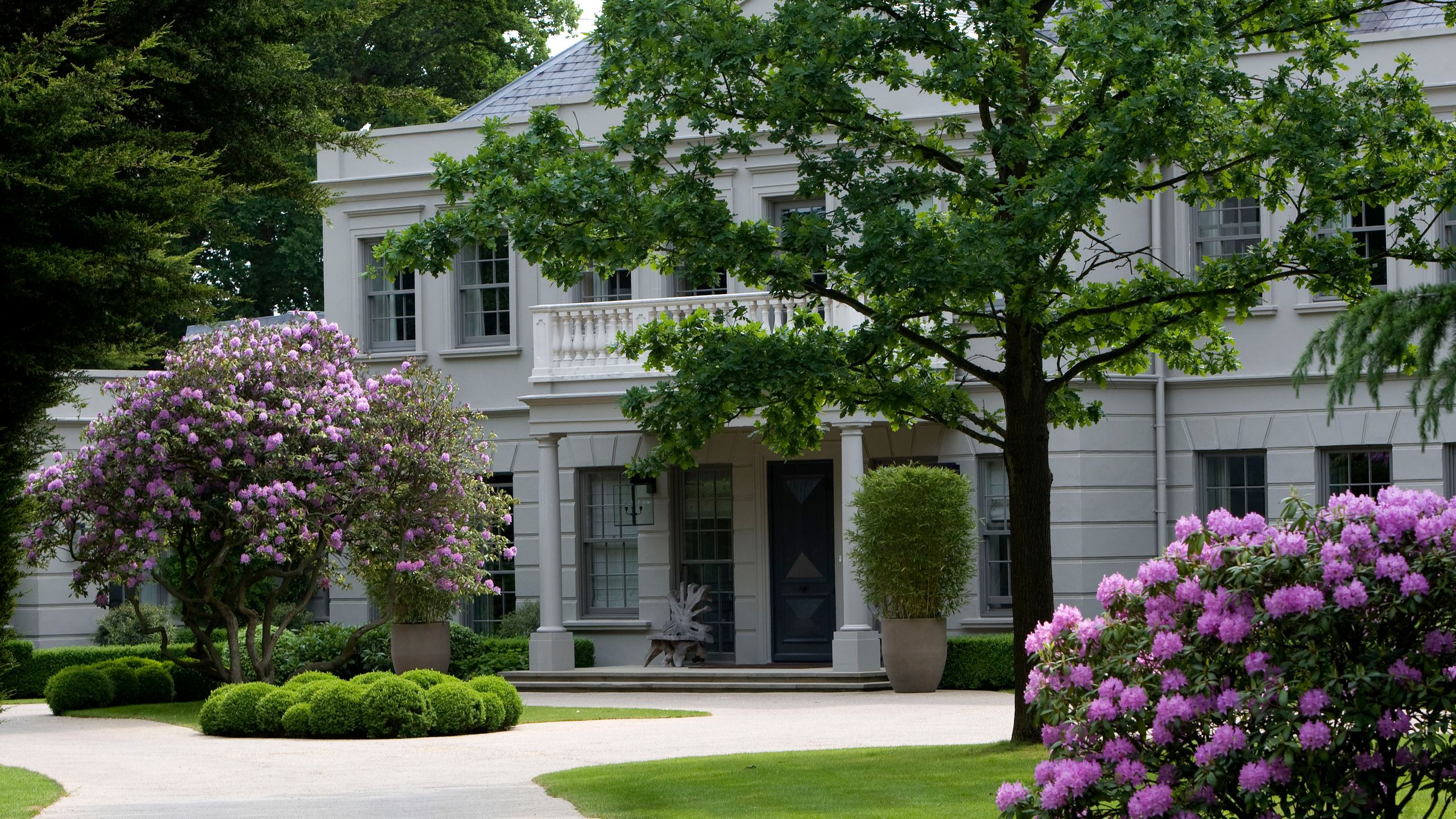 Image may contain: Grass, Plant, Vegetation, Architecture, Building, Housing, Lawn, Outdoors, Flower, House, and Nature