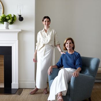 Image may contain: Luanne Rice, Person, Adult, Plant, Potted Plant, Accessories, Bracelet, Jewelry, Chair, and Furniture