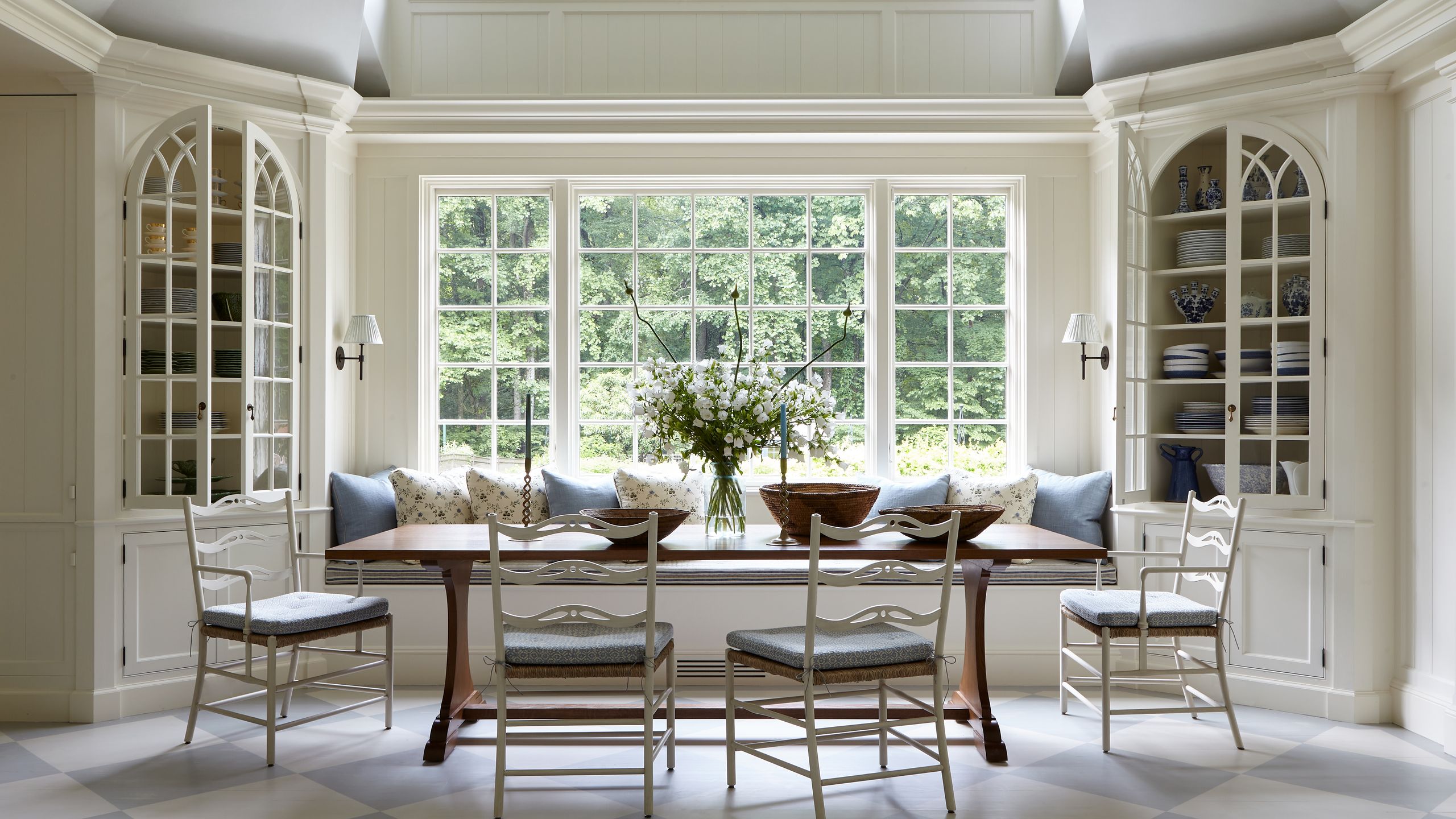 Image may contain: Chair, Furniture, Window, Table, Lamp, Dining Table, Desk, French Window, Architecture, and Building