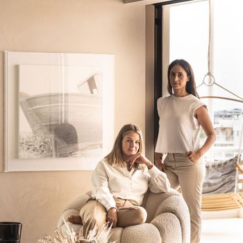 Image may contain: Isabel García Tejerina, People, Person, Adult, Face, Head, Cup, Couch, and Furniture