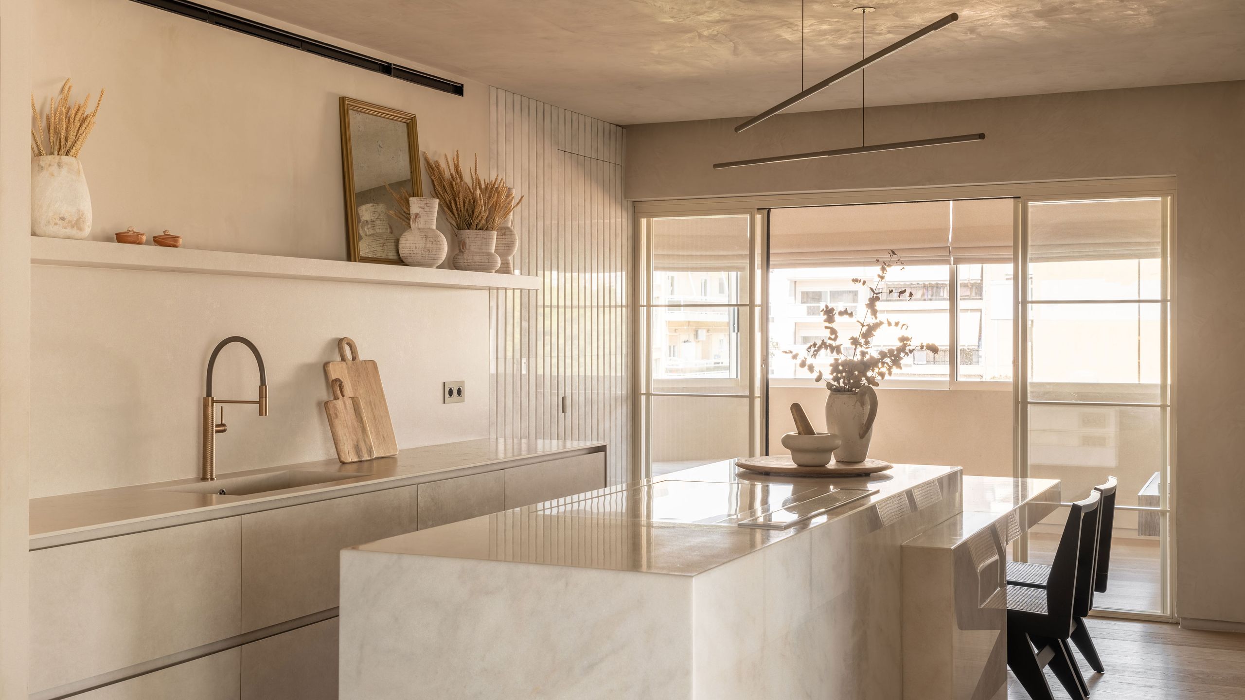 Image may contain: Indoors, Interior Design, Kitchen, Dining Table, Furniture, Table, Sink, Sink Faucet, and Architecture