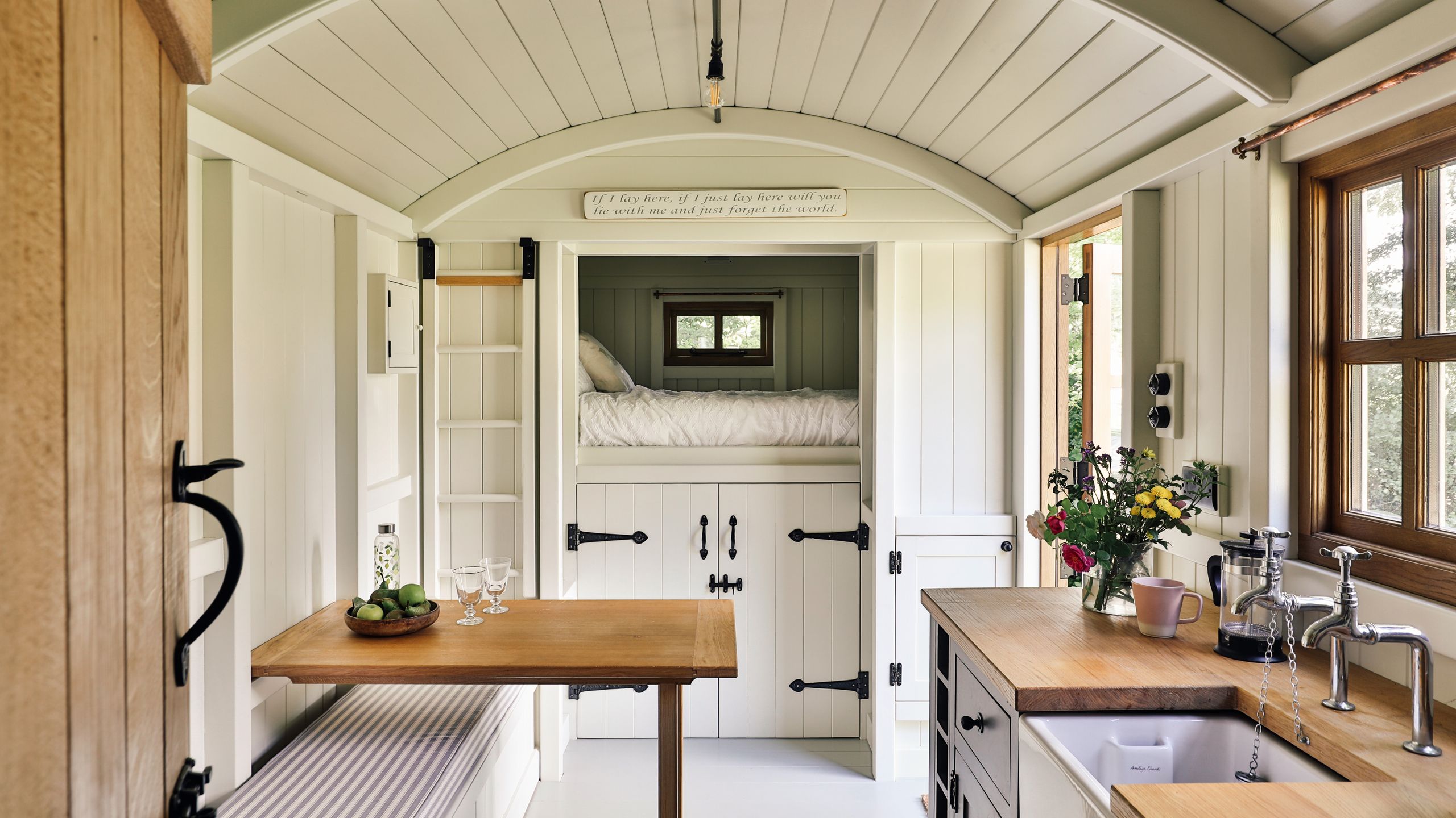 Image may contain: Indoors, Interior Design, Sink, Cup, Sink Faucet, and Kitchen