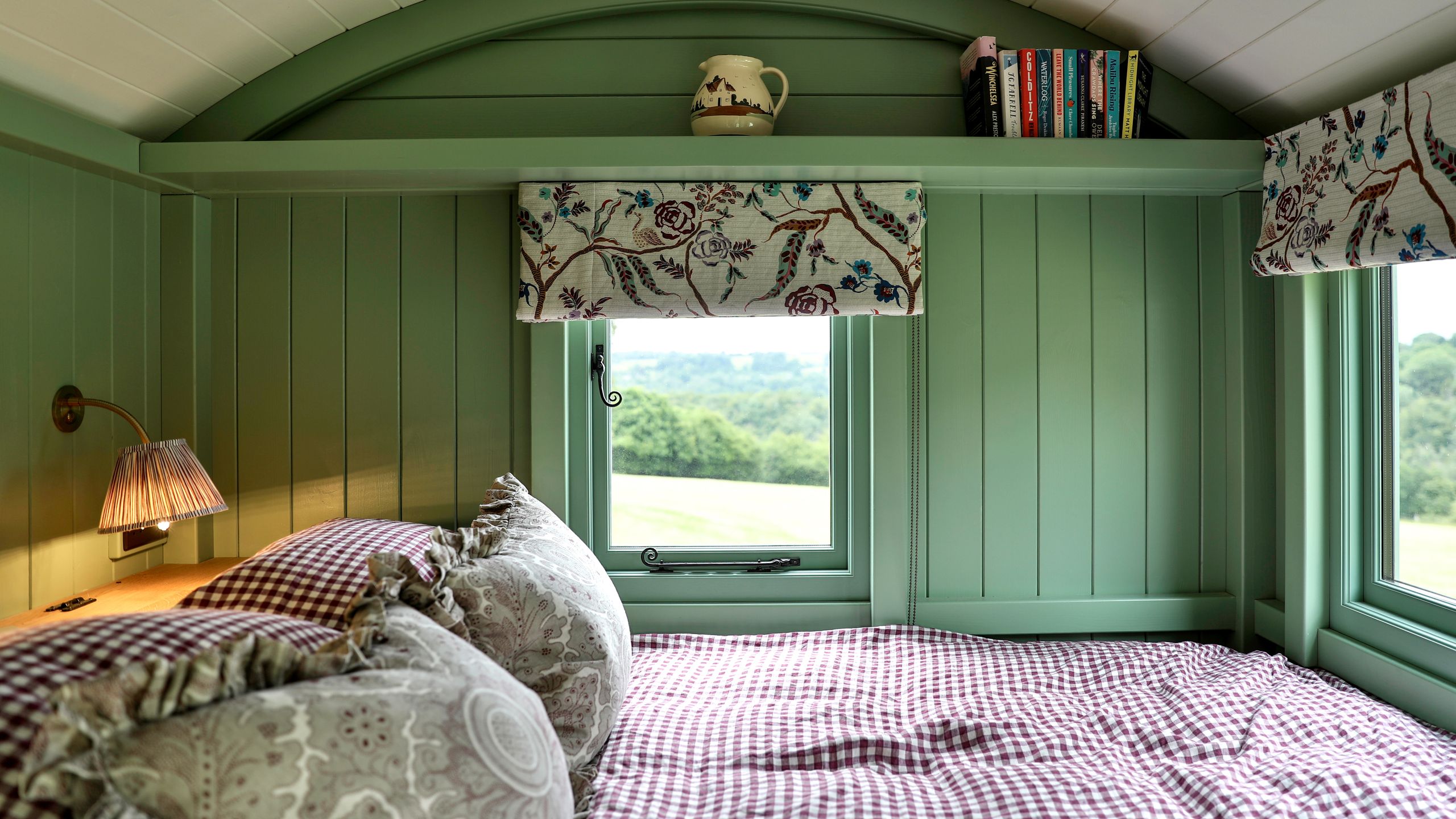 Image may contain: Indoors, Interior Design, Lamp, Cushion, Home Decor, Furniture, Bed, Bedroom, and Room