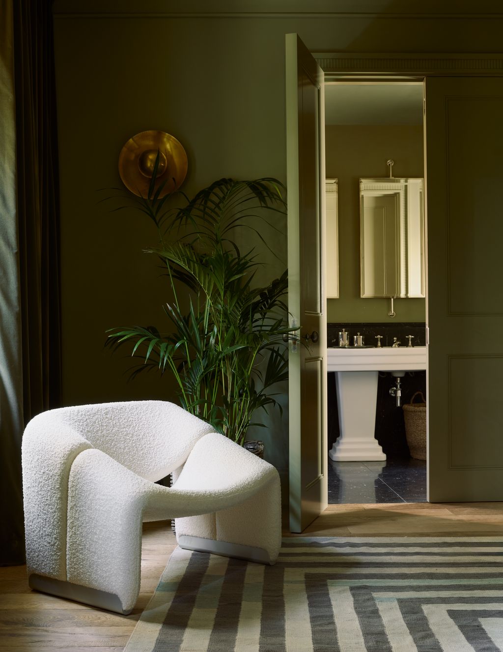 Image may contain Furniture Accessories Bag Handbag Home Decor Rug Plant Sink Sink Faucet and Floor