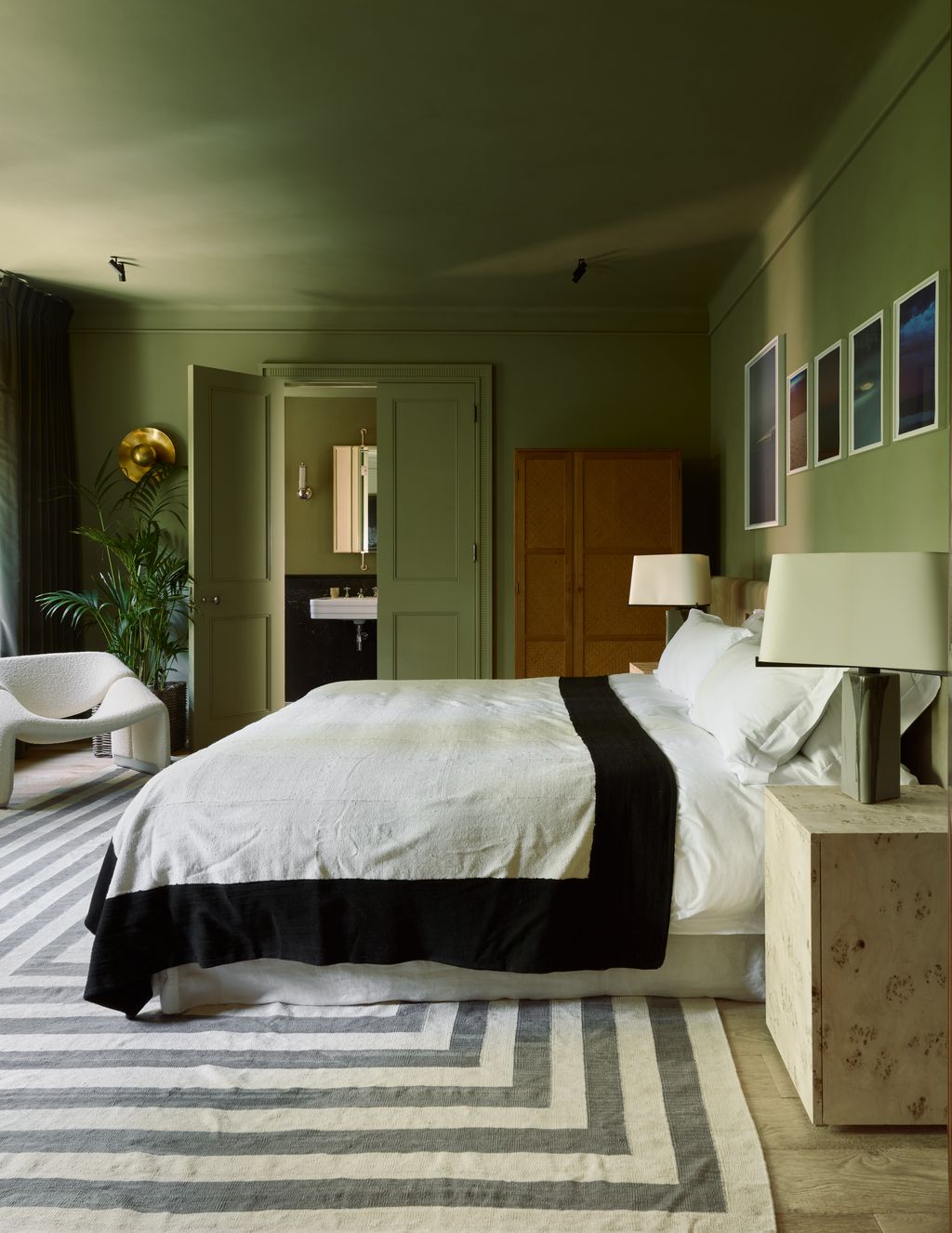 Image may contain Home Decor Lamp Plant Chair Furniture Bed Indoors Interior Design Rug Corner Sink and Cushion