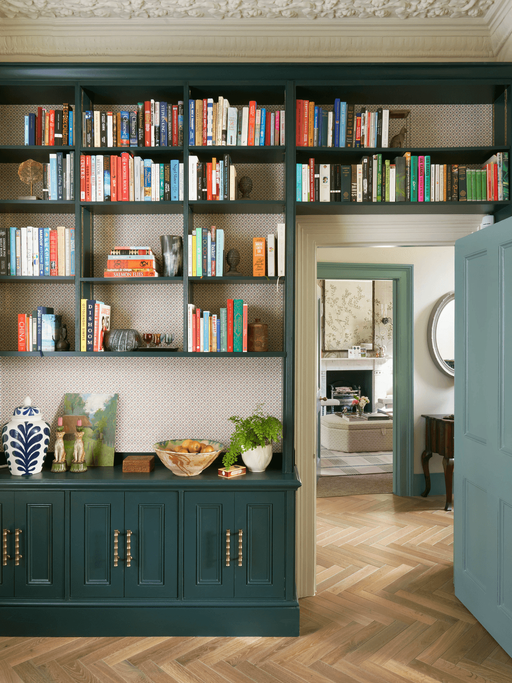 Image may contain Furniture Bookcase and Plant