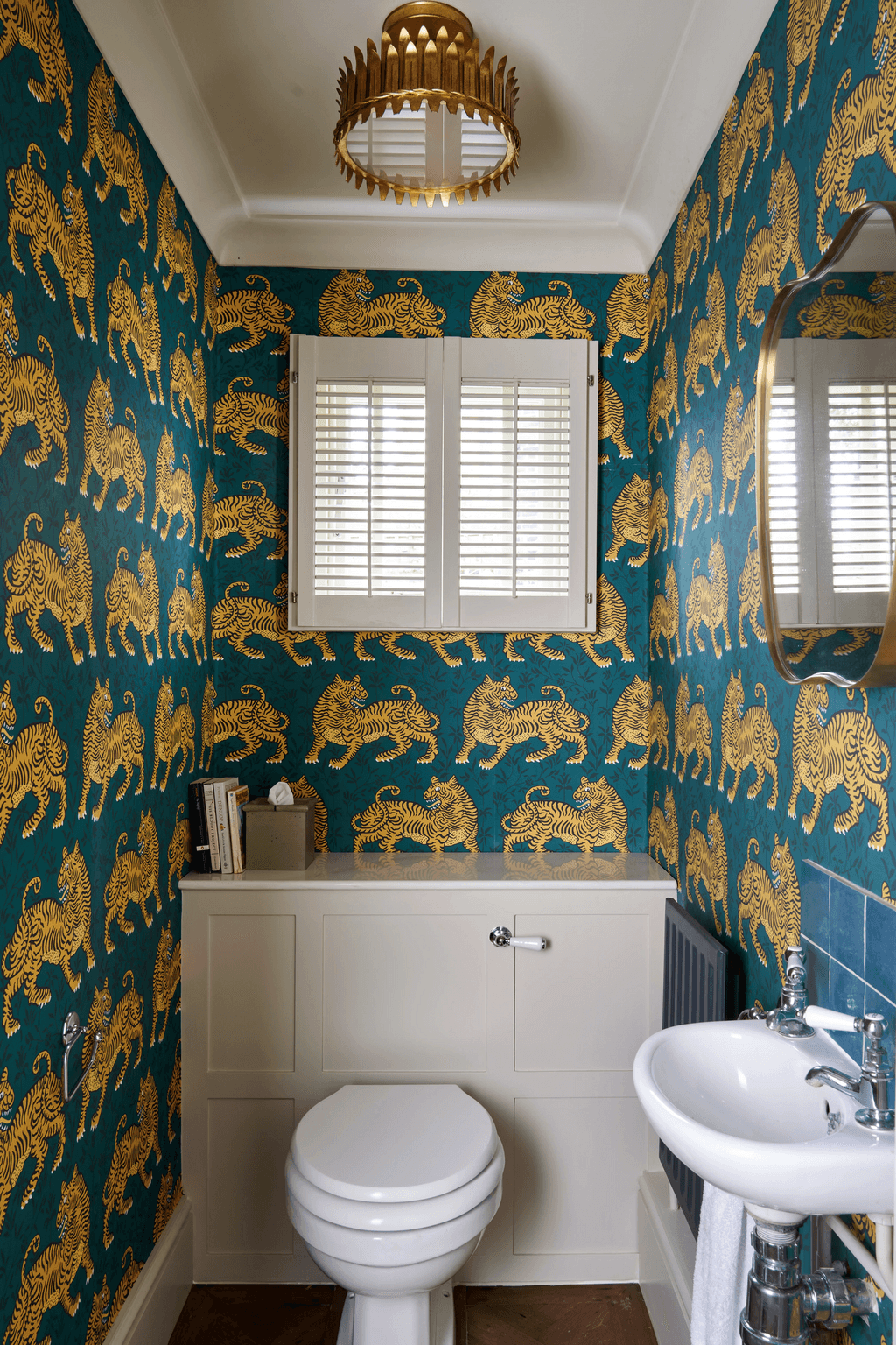 Image may contain Indoors Interior Design Chandelier Lamp Home Decor Sink Bathroom Room Toilet and Sink Faucet