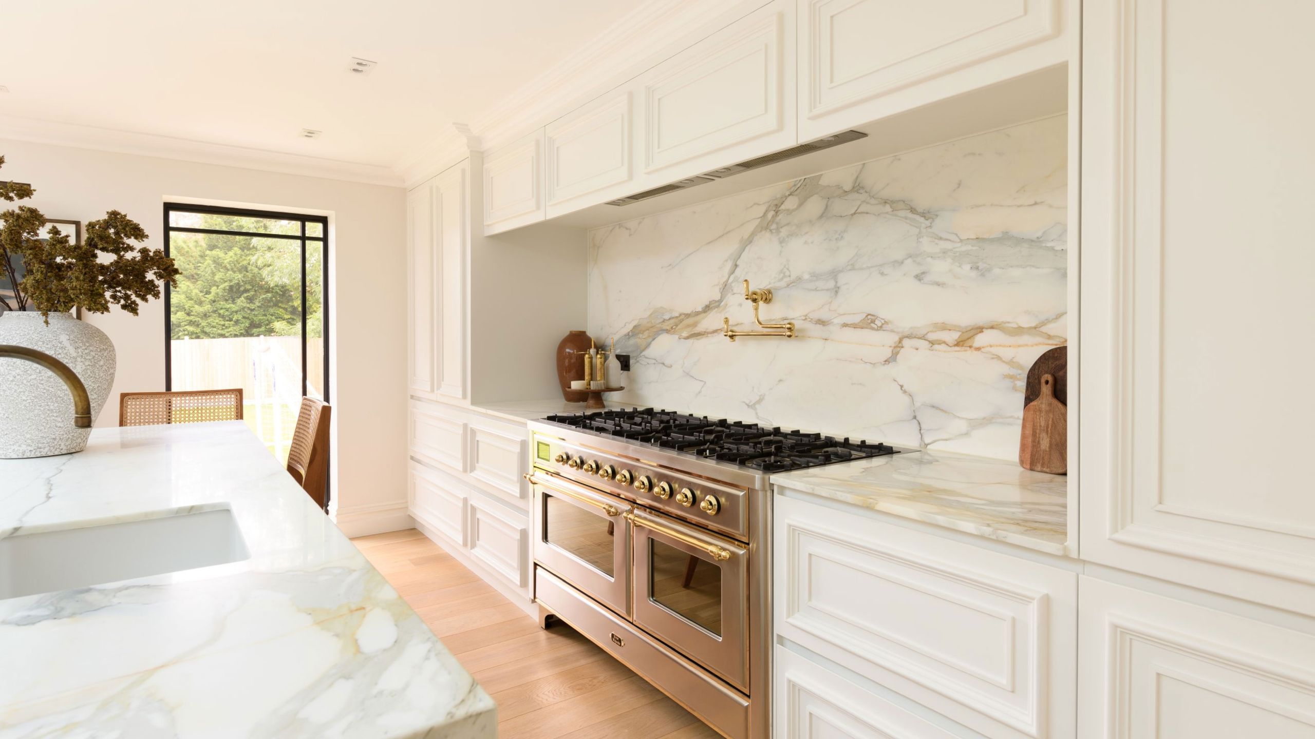 Image may contain: Indoors, Interior Design, Kitchen, Chair, Furniture, Cooktop, and Plant