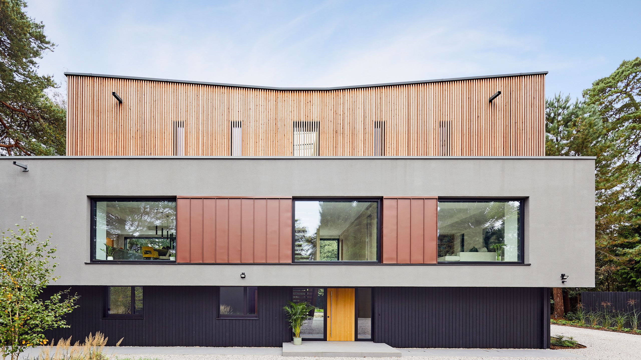 Image may contain: Indoors, Interior Design, Architecture, Building, House, Housing, Villa, Plant, Wood Panels, and Garage