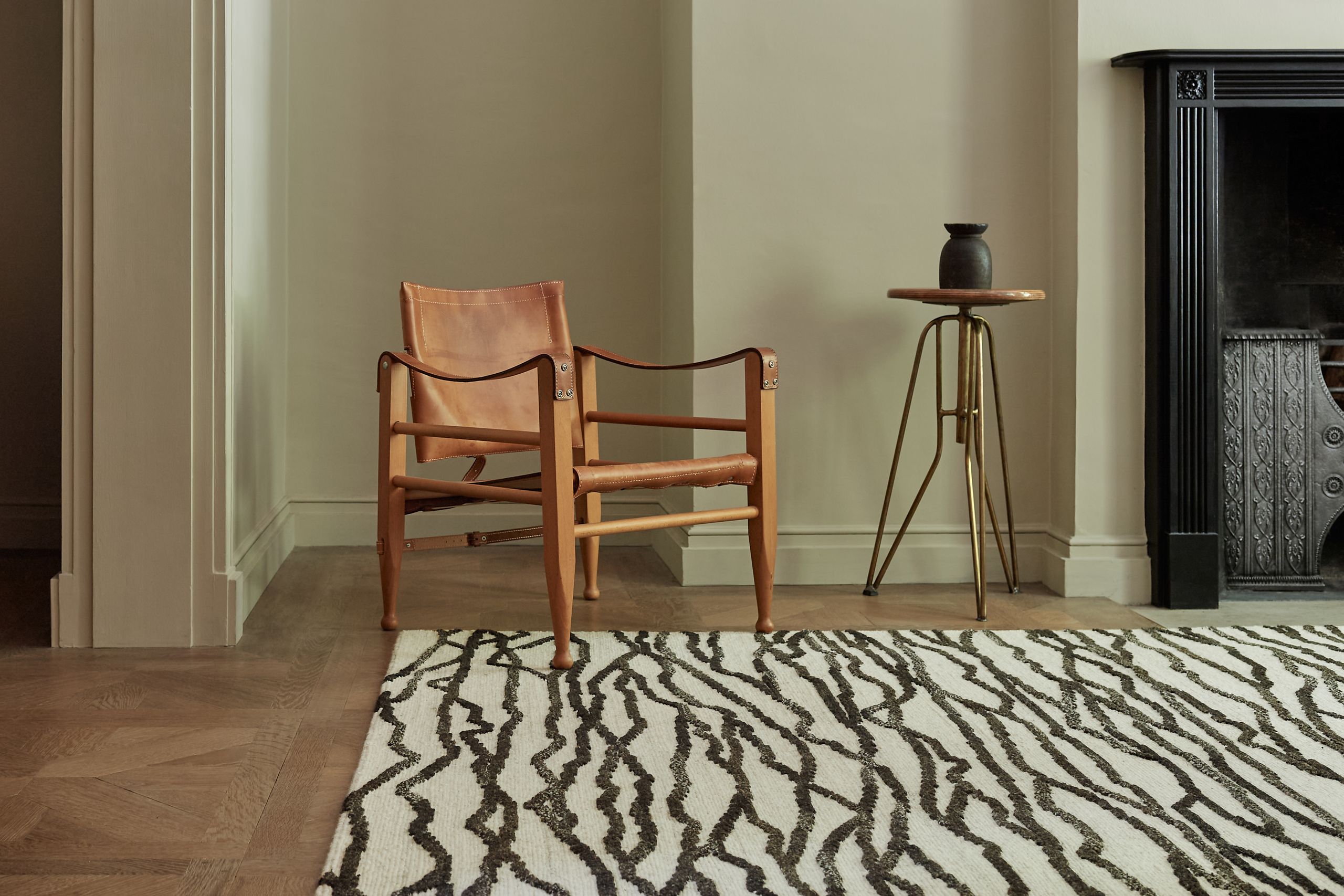 Image may contain: Home Decor, Rug, Chair, Furniture, and Floor