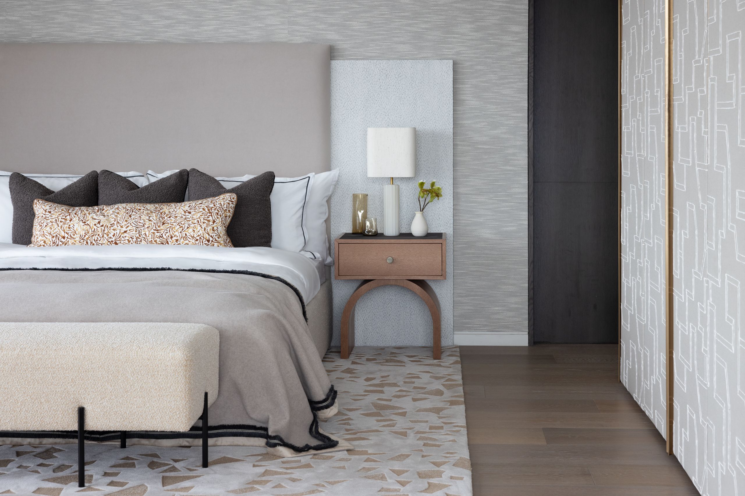 Image may contain: Indoors, Interior Design, Lamp, Home Decor, Cushion, Bed, Furniture, Bedroom, Room, Rug, Floor, and Cup