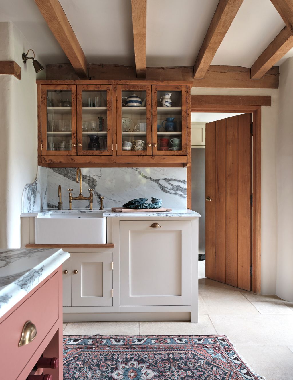 Image may contain Indoors Interior Design Lamp Sink Home Decor Rug Cup Wood Sink Faucet Closet and Cupboard