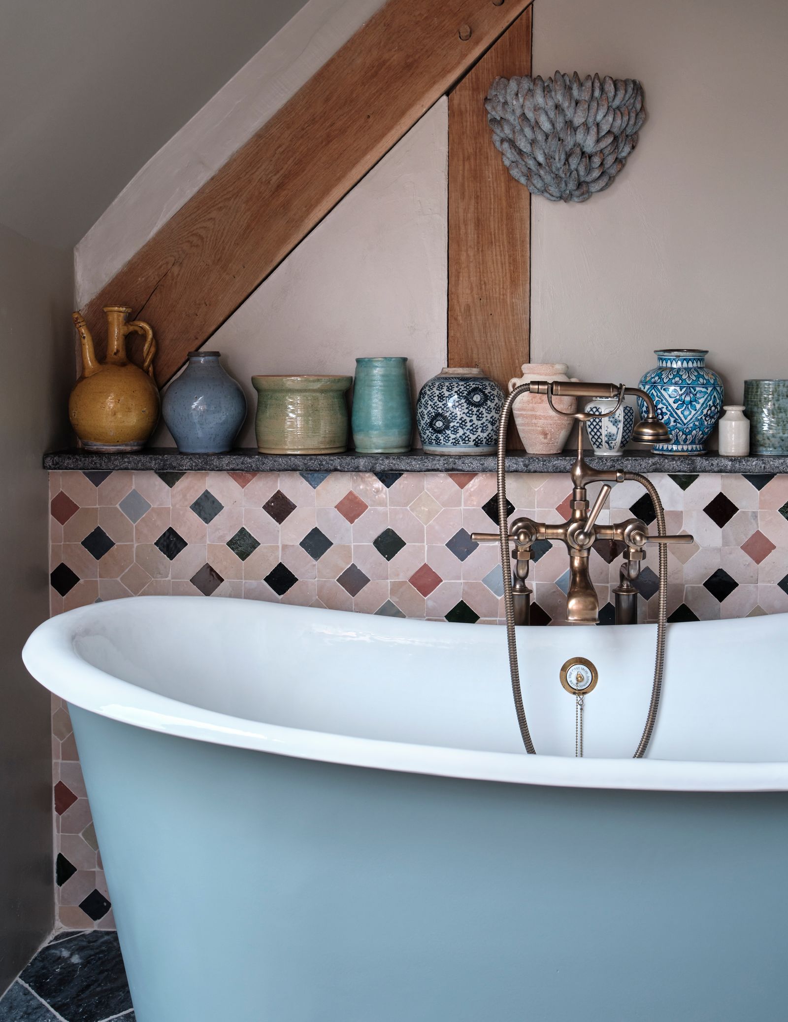 Image may contain Bathing Bathtub Person Tub Indoors Interior Design Cup Sink and Sink Faucet