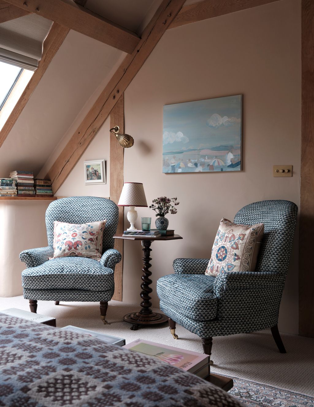 Image may contain Lamp Desk Furniture Table Chair Art Painting Cup Home Decor Book Publication and Cushion