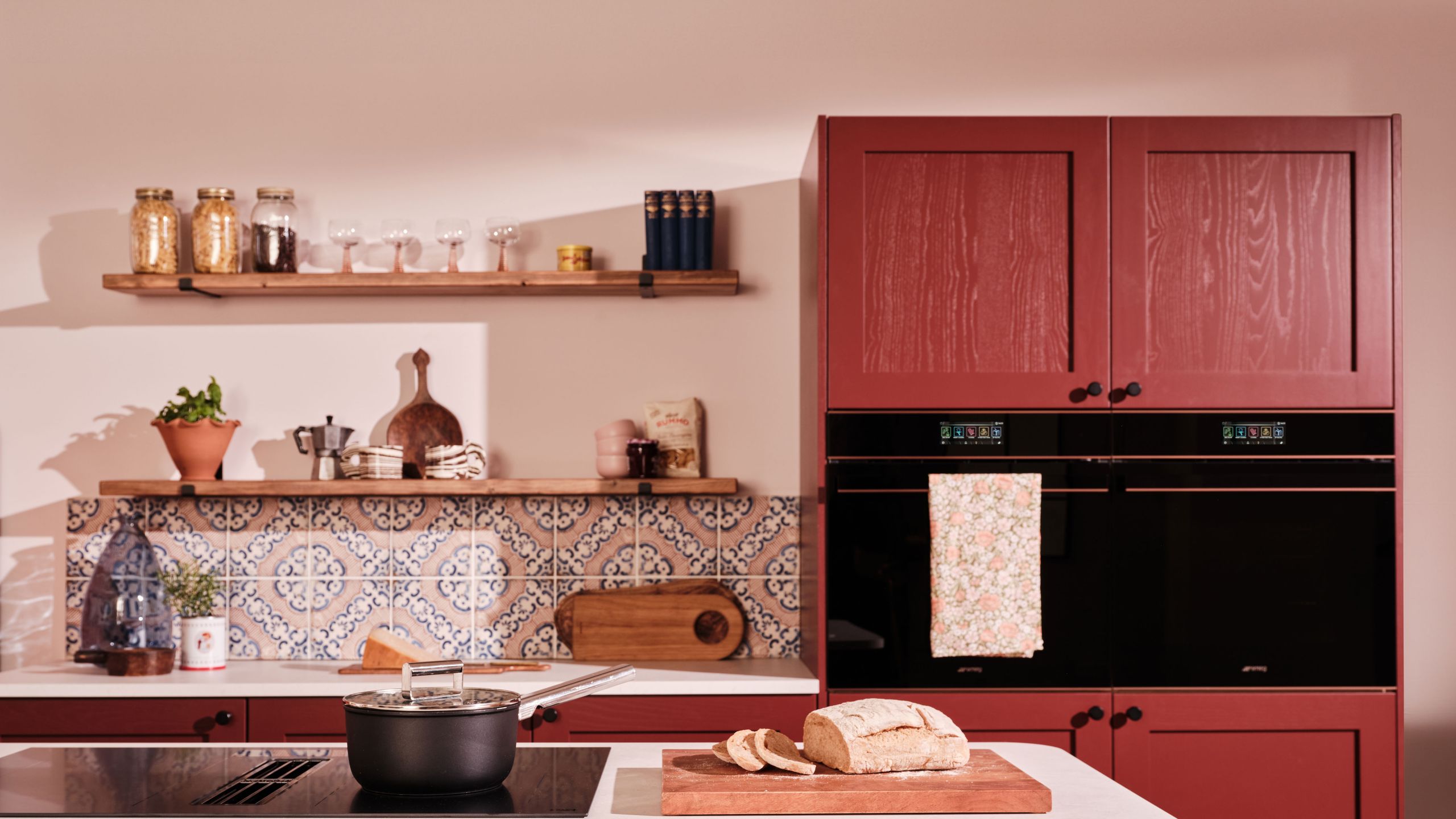 Image may contain: Indoors, Interior Design, Kitchen, Bread, Food, Plant, Sink, Sink Faucet, Cabinet, Furniture, and Cooktop