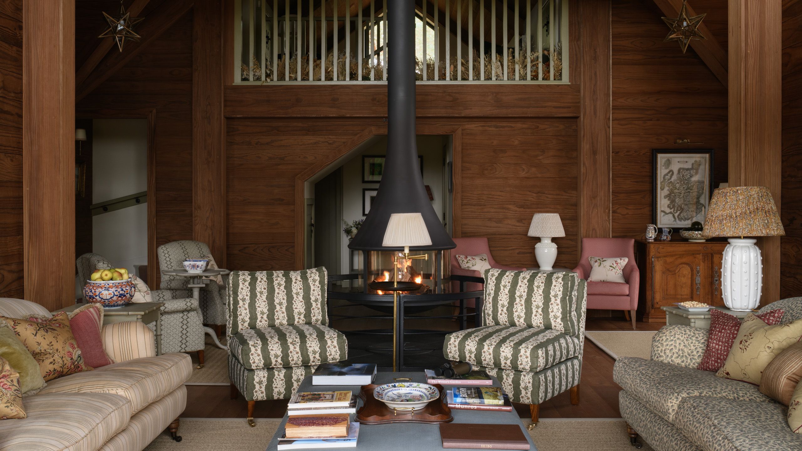 Image may contain: Lamp, Book, Publication, Indoors, Interior Design, Chair, Furniture, Couch, Architecture, and Building