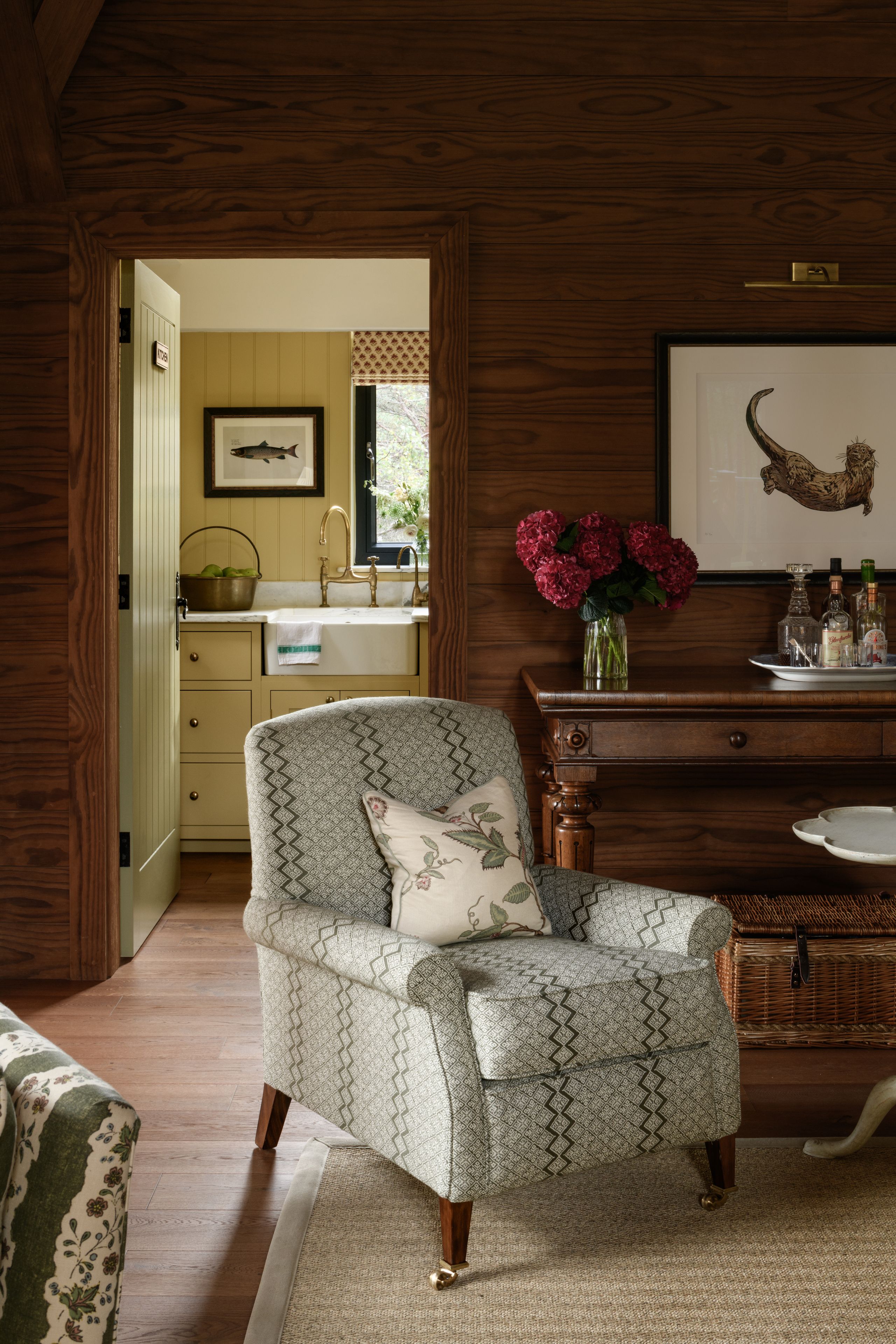 Image may contain: Indoors, Interior Design, Furniture, Chair, Art, Painting, Couch, Home Decor, Rug, Plate, and Architecture