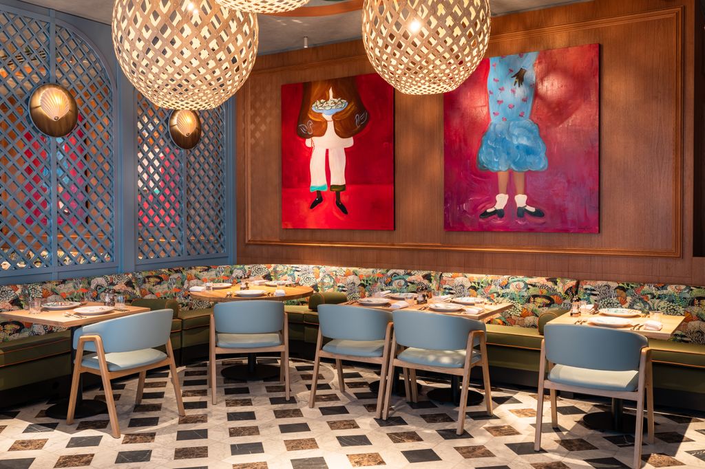 Image may contain Indoors Restaurant Architecture Building Dining Room Dining Table Furniture Room Table and Chair