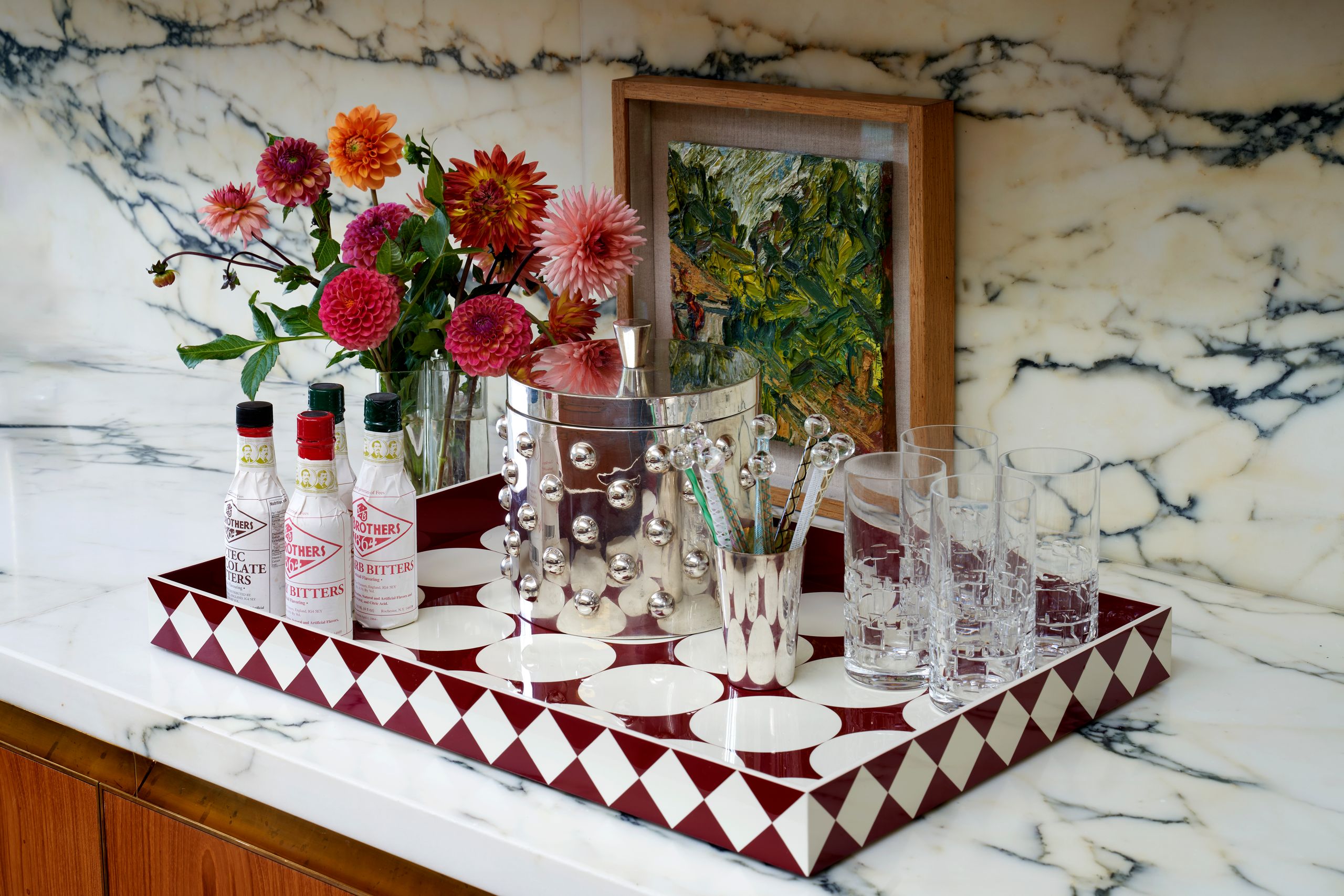 Image may contain: Furniture, Table, Tabletop, Cup, Plate, Flower, Plant, Pottery, Glass, Flower Arrangement, and Window