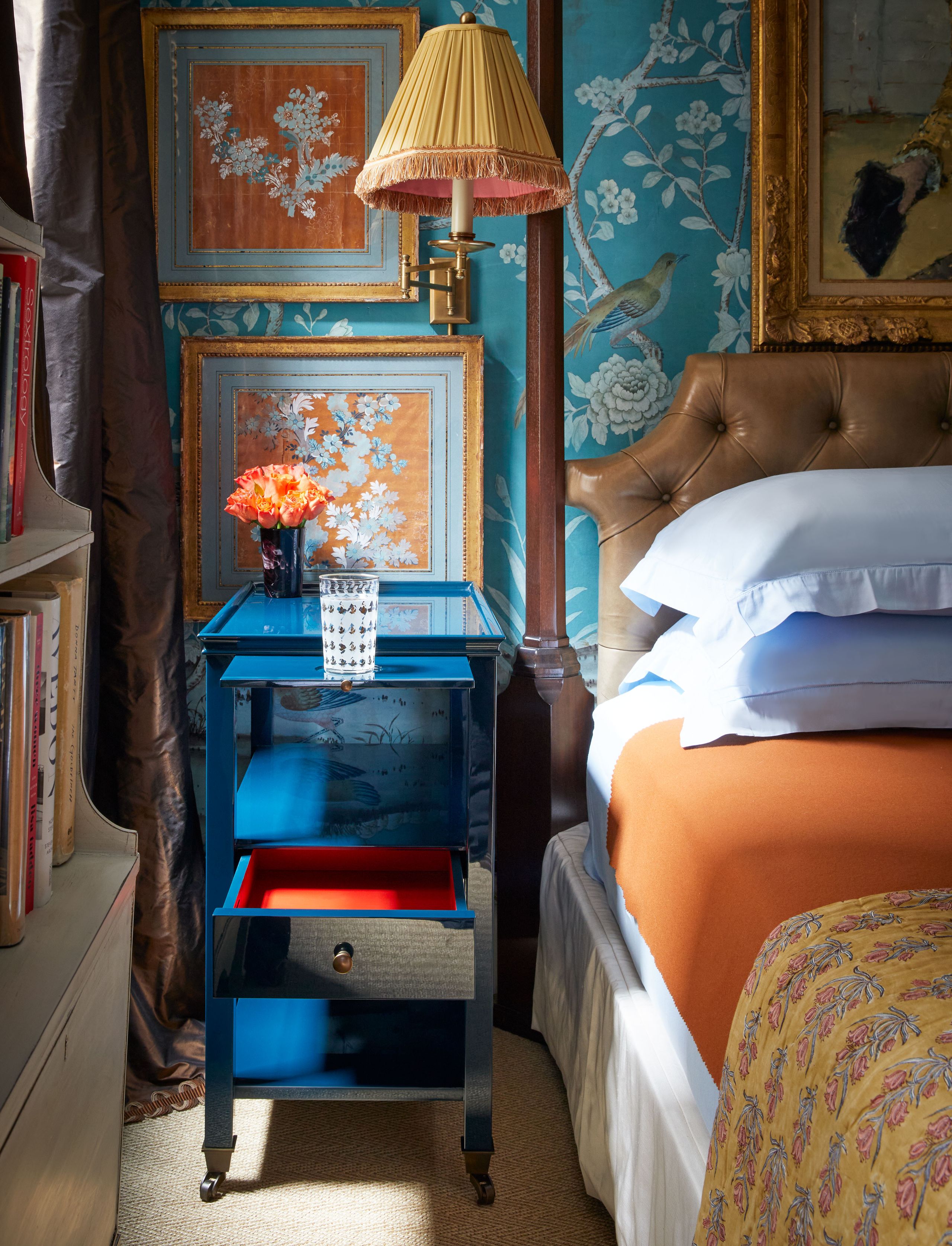 Image may contain: Lamp, Bed, Furniture, Table Lamp, Art, Painting, Person, Bedroom, Indoors, Room, Animal, Bird, and Cup