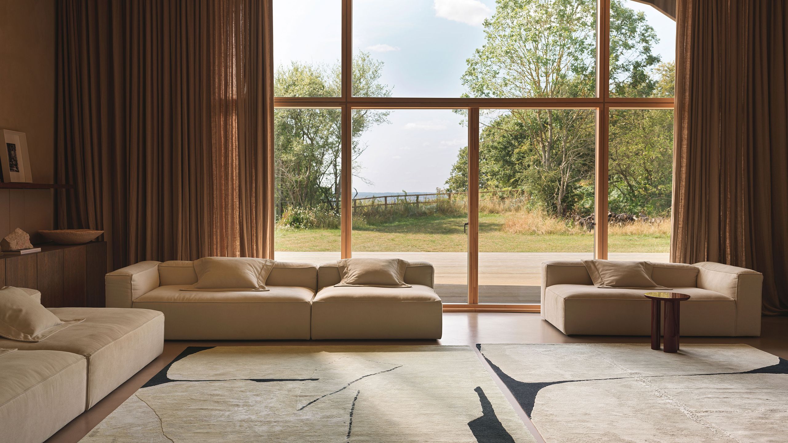 Image may contain: Home Decor, Rug, Indoors, Interior Design, Coffee Table, Furniture, Table, Couch, and Architecture