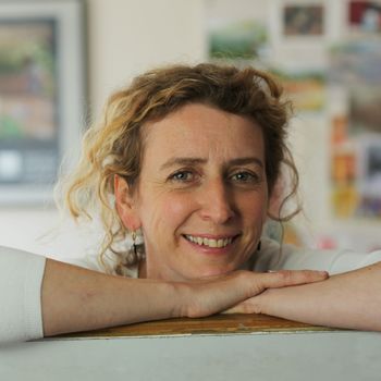 Image may contain: Face, Happy, Head, Person, Smile, Photography, Portrait, Adult, Blonde, Hair, Accessories, and Earring