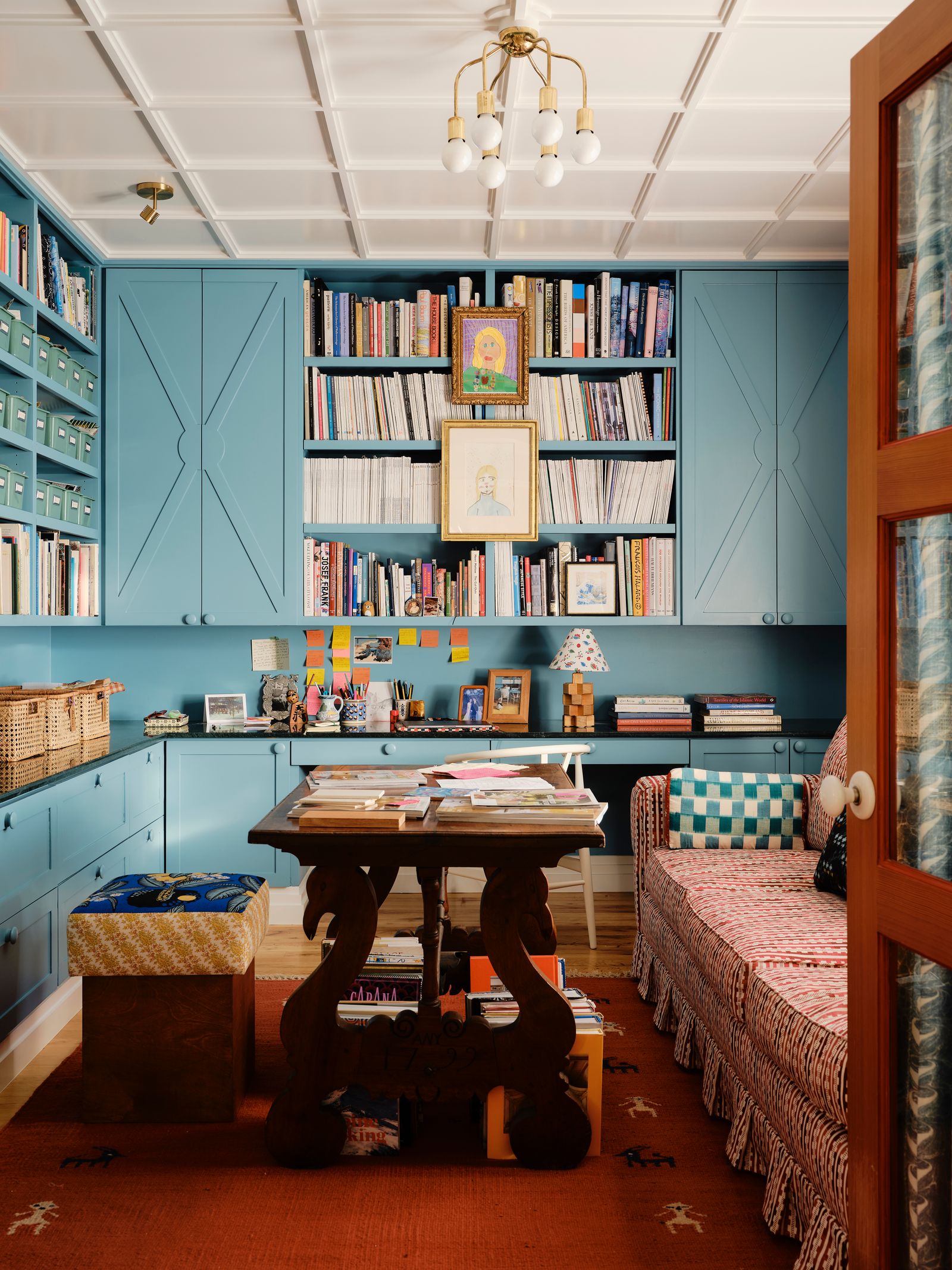 Image may contain Furniture Lamp Art Painting Desk Table Couch Bookcase Indoors Interior Design Bed and Bedroom