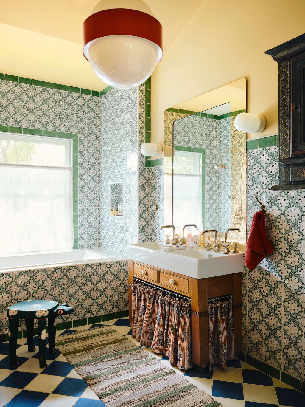 Image may contain Lamp Sink Sink Faucet Corner Home Decor Rug Bathing Bathtub Person and Tub