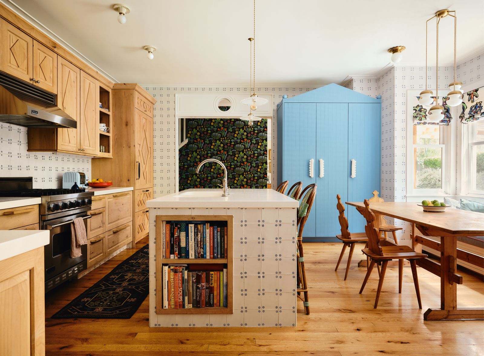 Image may contain Indoors Interior Design Kitchen Home Decor Rug Chair Furniture Wood Sink and Sink Faucet