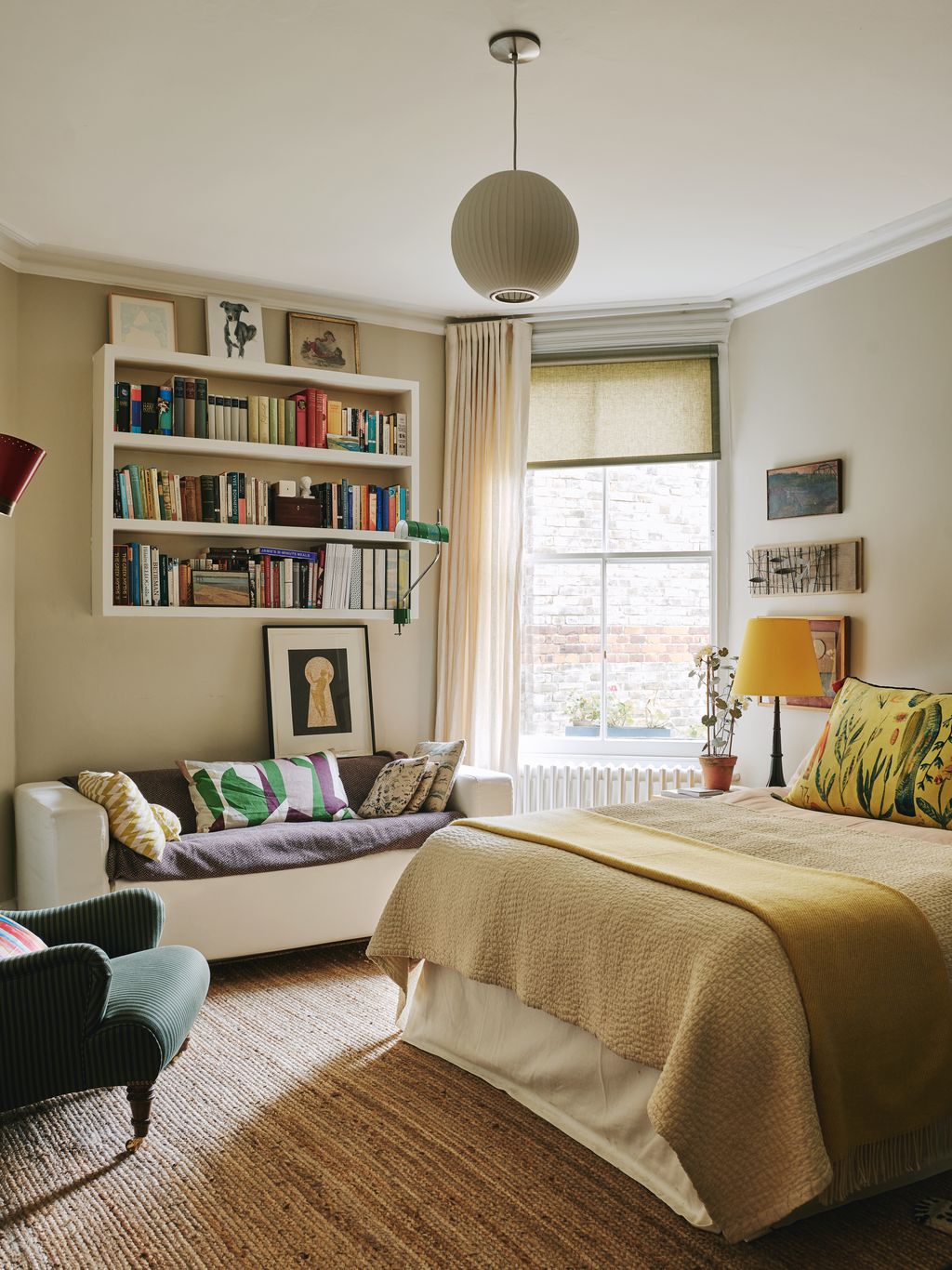 Image may contain Lamp Plant Art Painting Home Decor Couch Furniture Bed Chair Person and Cushion