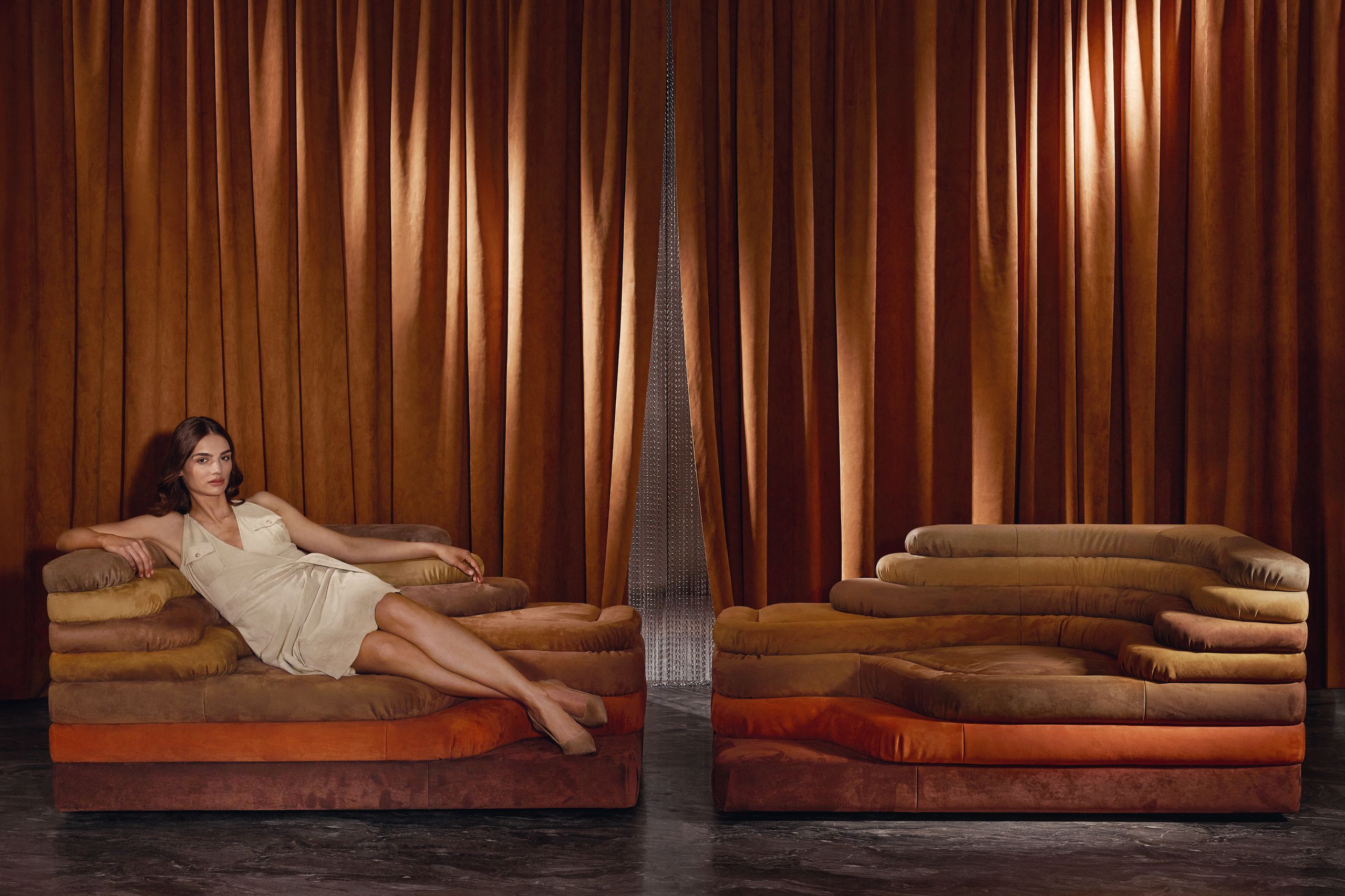 Image may contain: Couch, Furniture, Adult, and Person