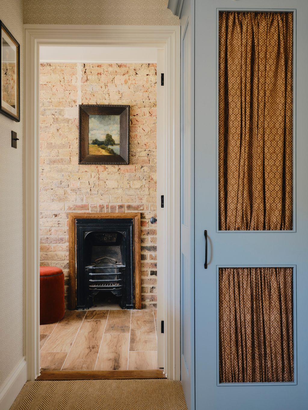 Image may contain Indoors Interior Design Fireplace Art Painting Wood Hearth Wood Panels Home Decor and Hardwood