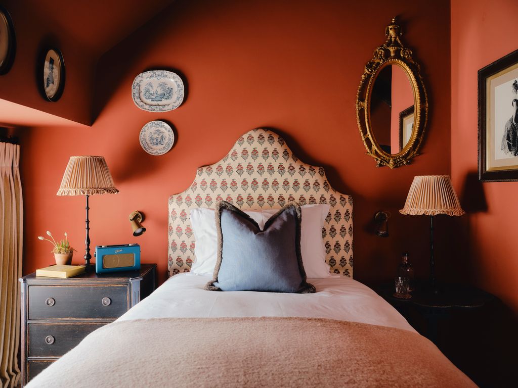 Image may contain Cushion Home Decor Lamp Book Publication Bed Furniture Art Painting Pillow Plate and Plant