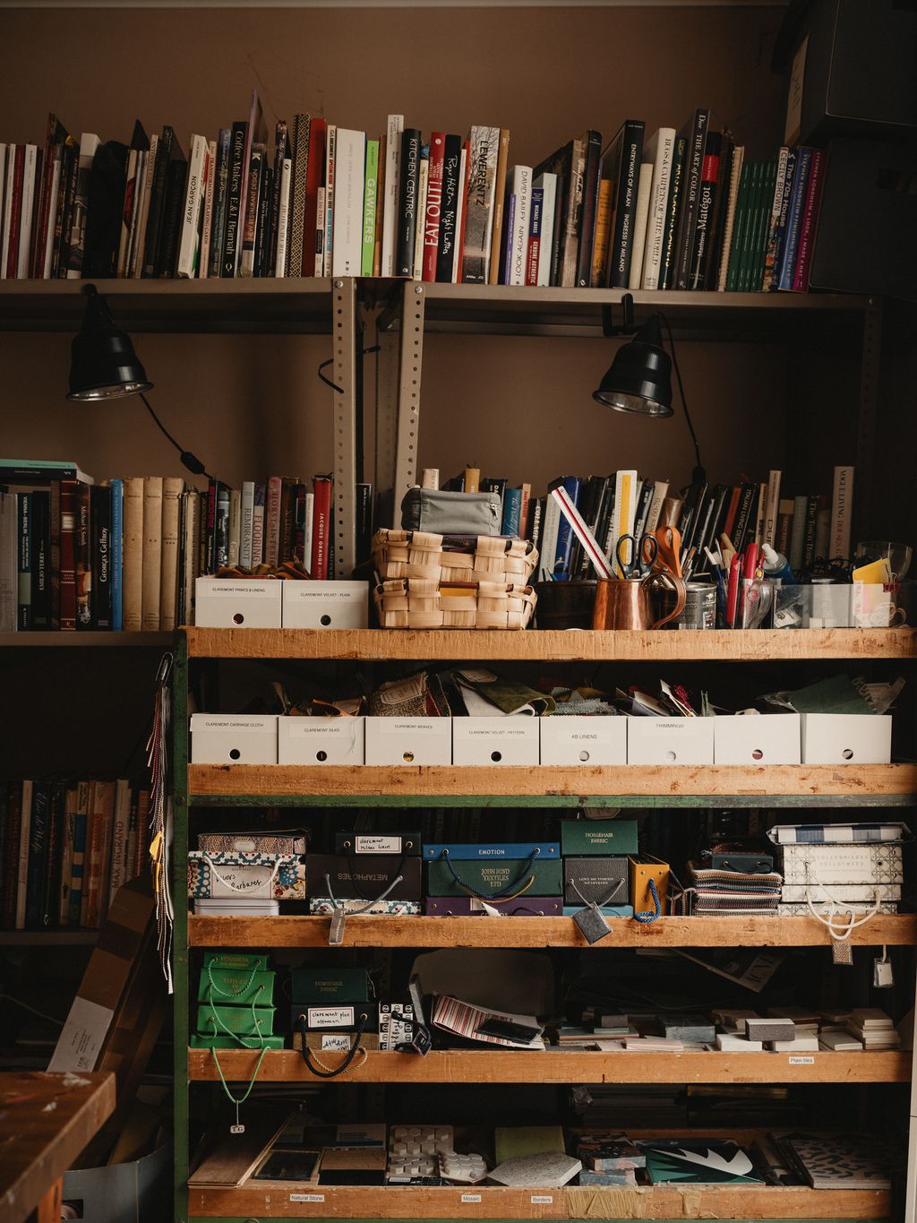 Image may contain Furniture Bookcase Lamp Accessories Bag Handbag Box and Cup