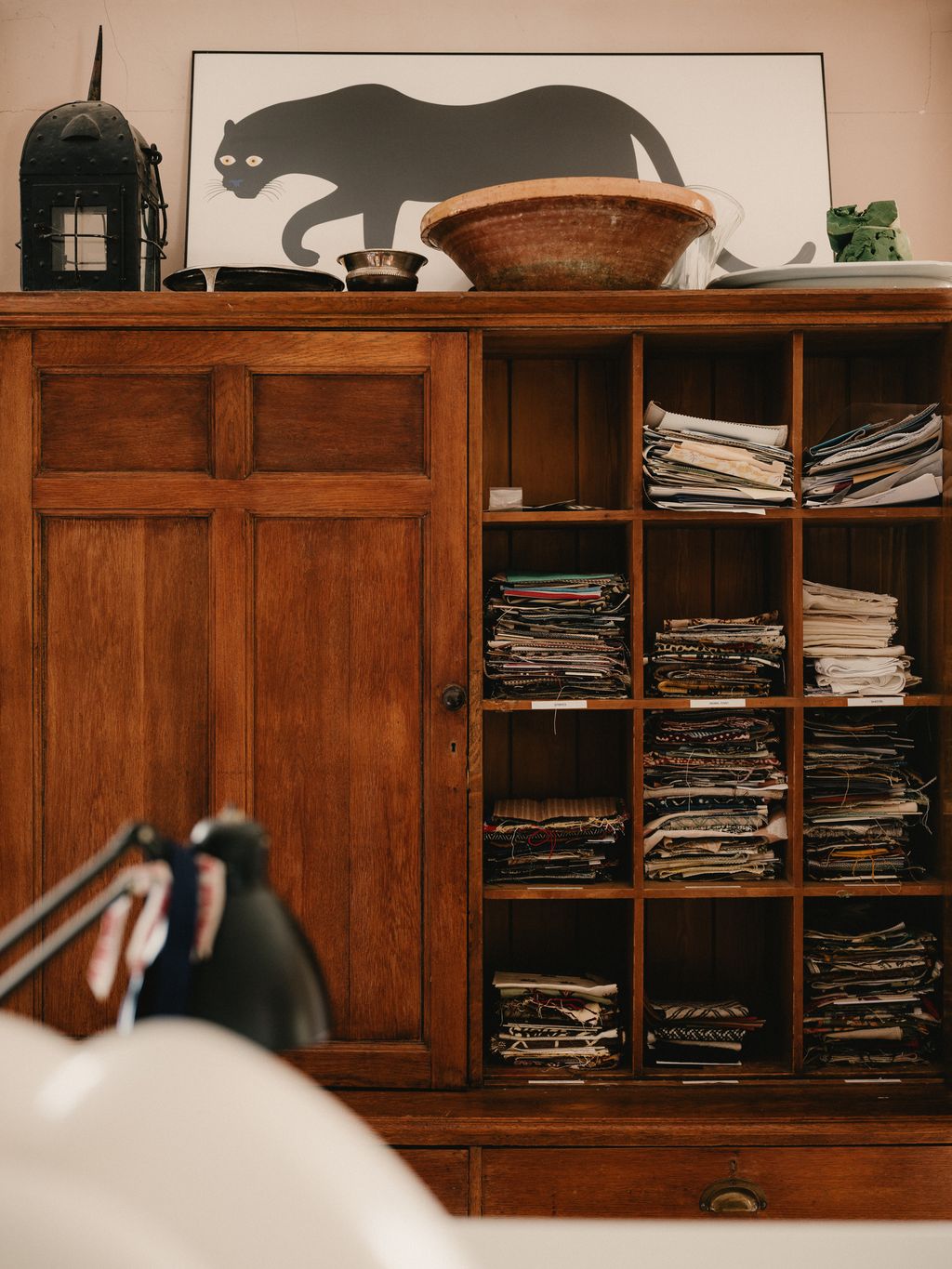 Image may contain Wood Furniture Indoors Interior Design Hardwood Closet Cupboard Stained Wood Bookcase and Cabinet