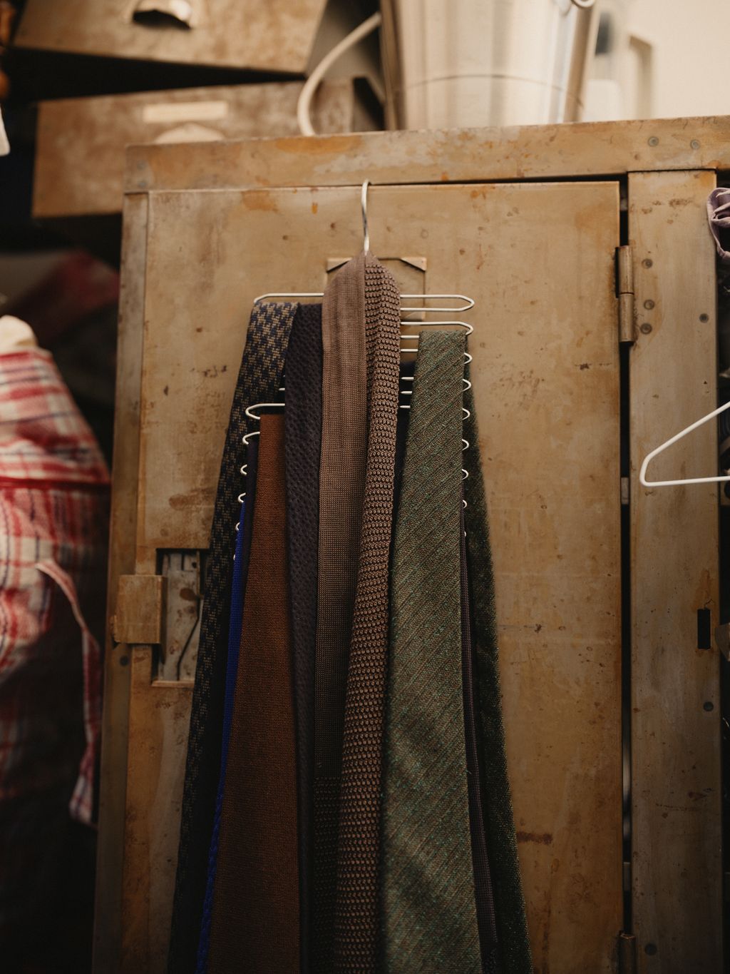 Image may contain Furniture Accessories Formal Wear Tie Adult Person and Indoors