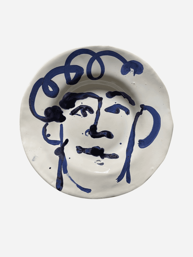 Image may contain: Art, Porcelain, Pottery, Food, Meal, Dish, and Person