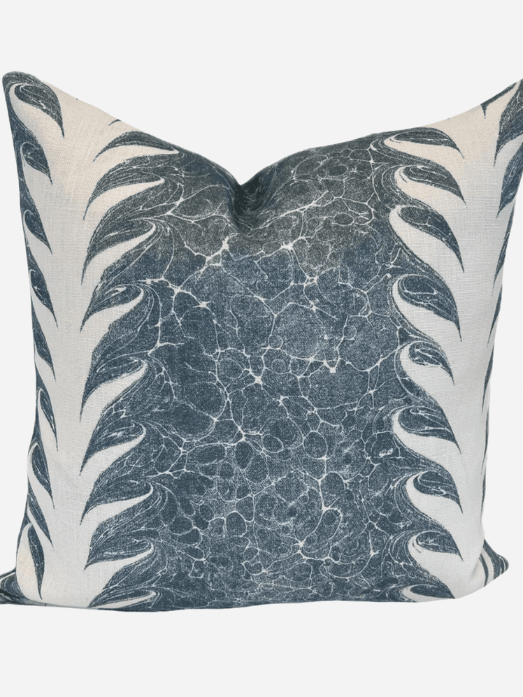 Image may contain: Cushion, Home Decor, Pillow, Person, Skin, and Tattoo