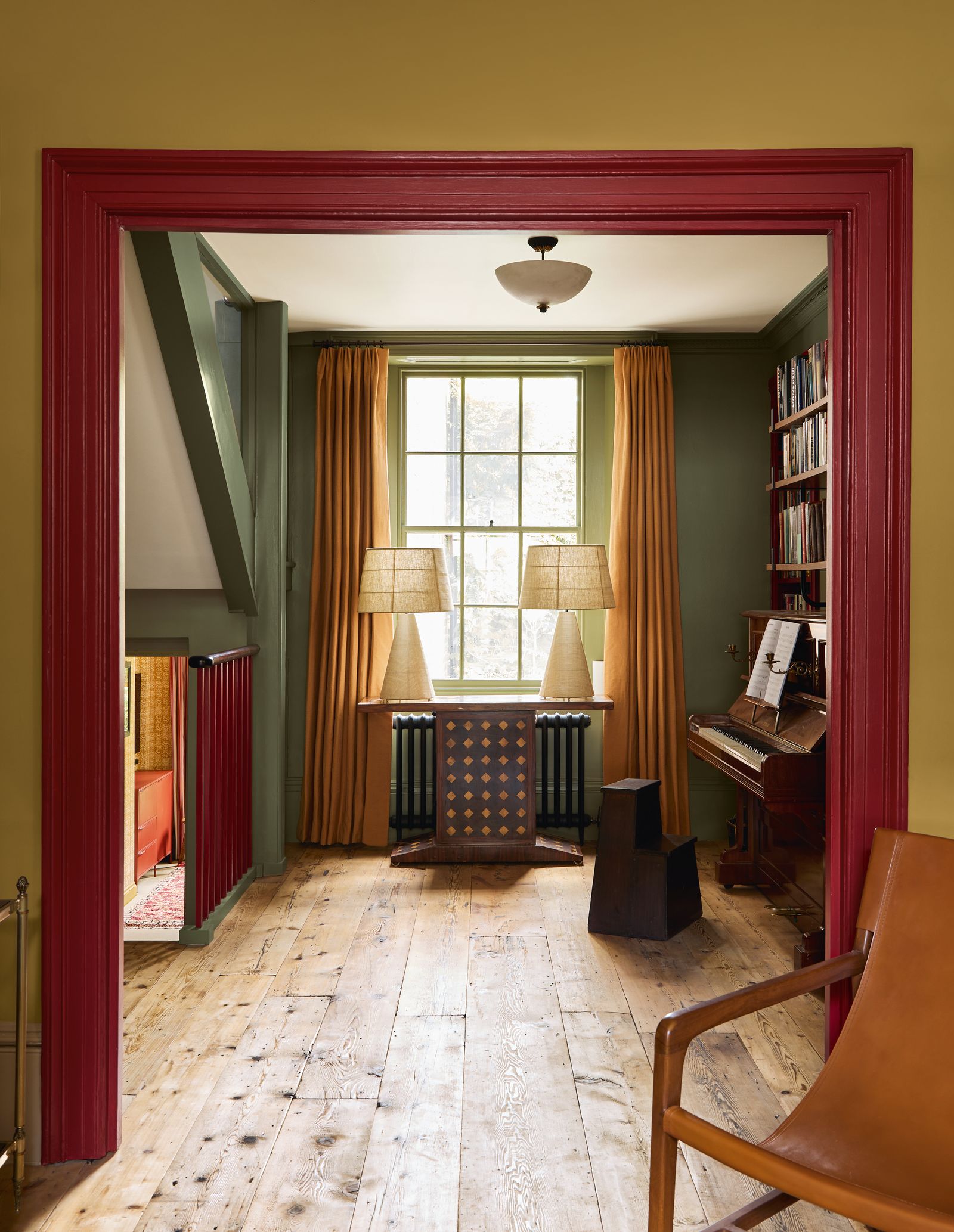 Image may contain Lamp Indoors Interior Design Chair Furniture Floor Flooring Keyboard Musical Instrument and Piano