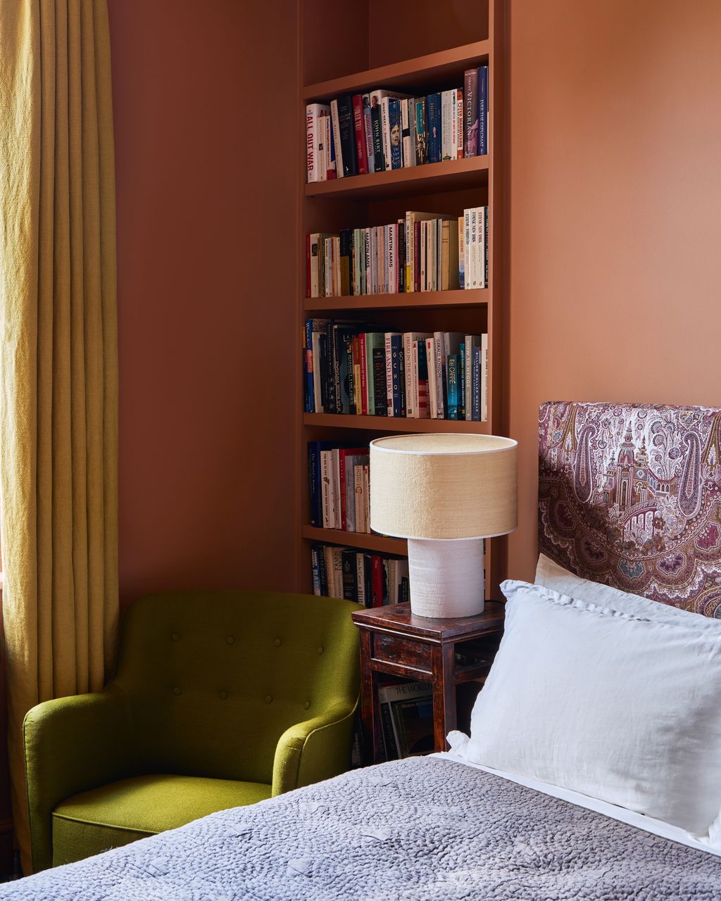 Image may contain Lamp Furniture Bookcase Bed and Chair