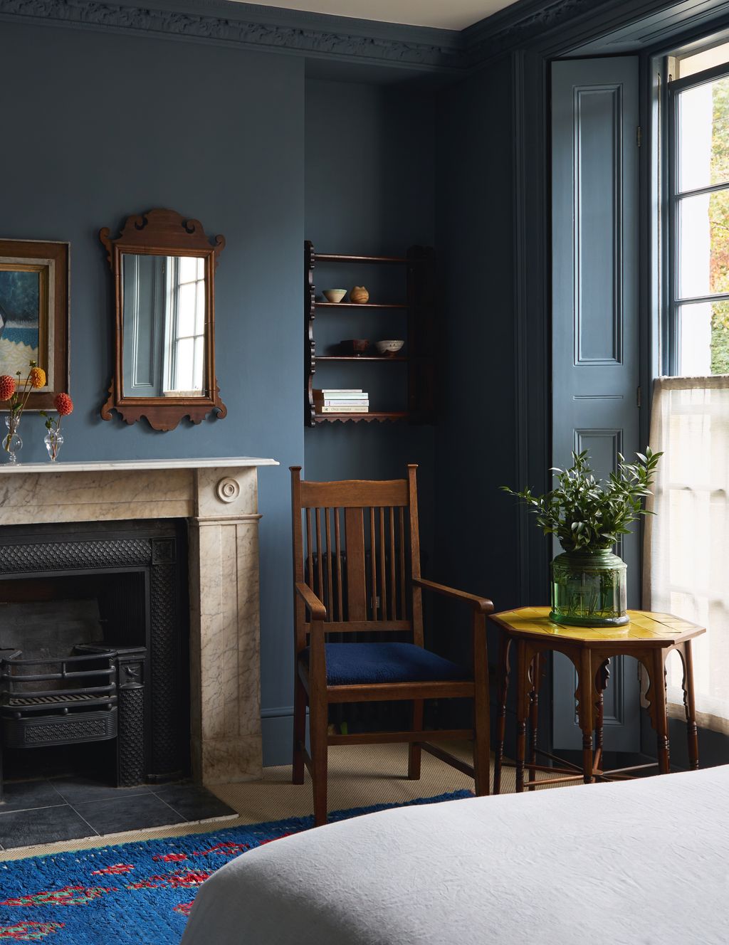 Image may contain Indoors Interior Design Chair Furniture Fireplace Home Decor Bed Desk Table Art and Painting