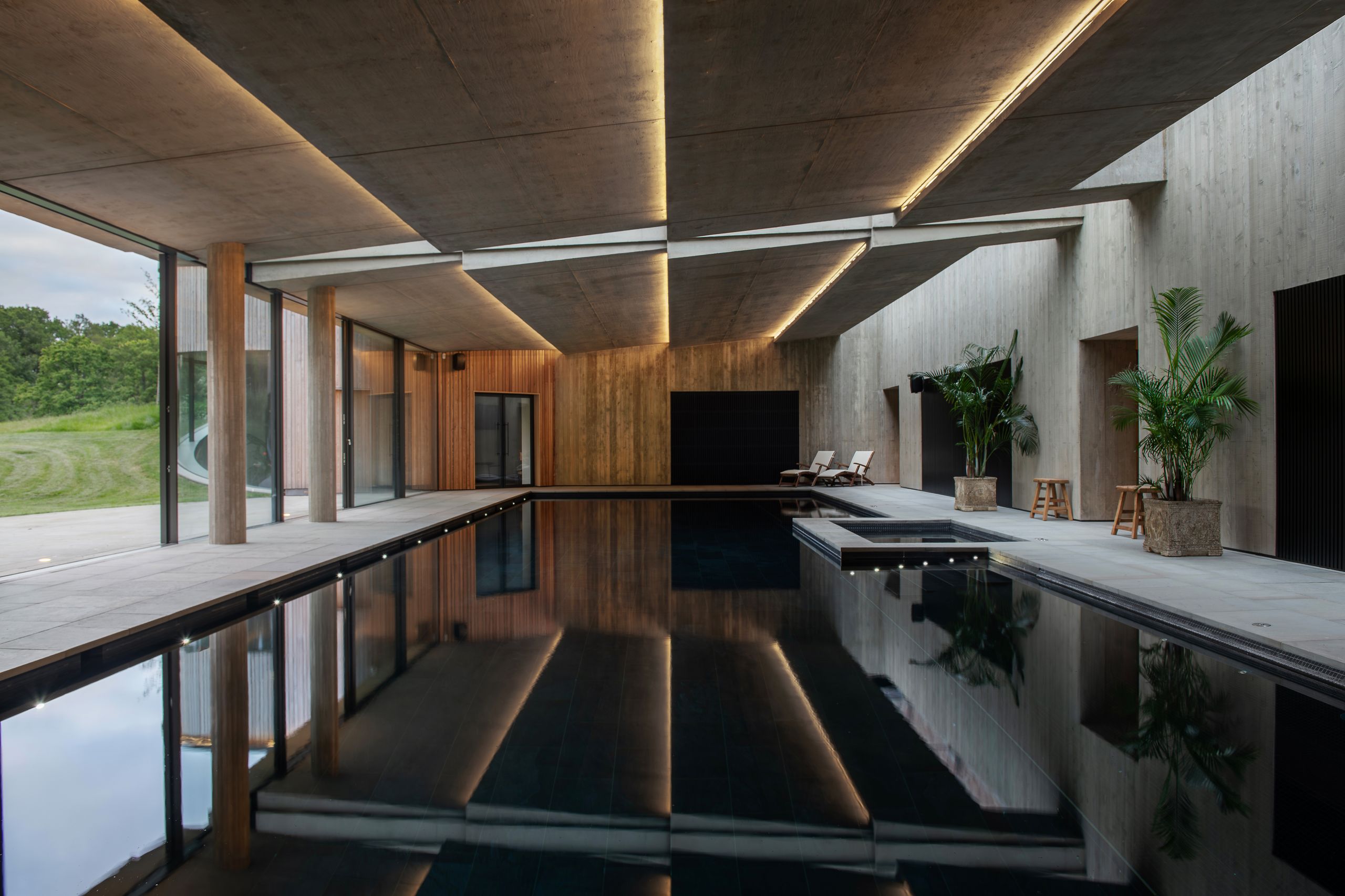 Image may contain: Indoors, Interior Design, Plant, Pool, Water, Swimming Pool, Chair, and Furniture