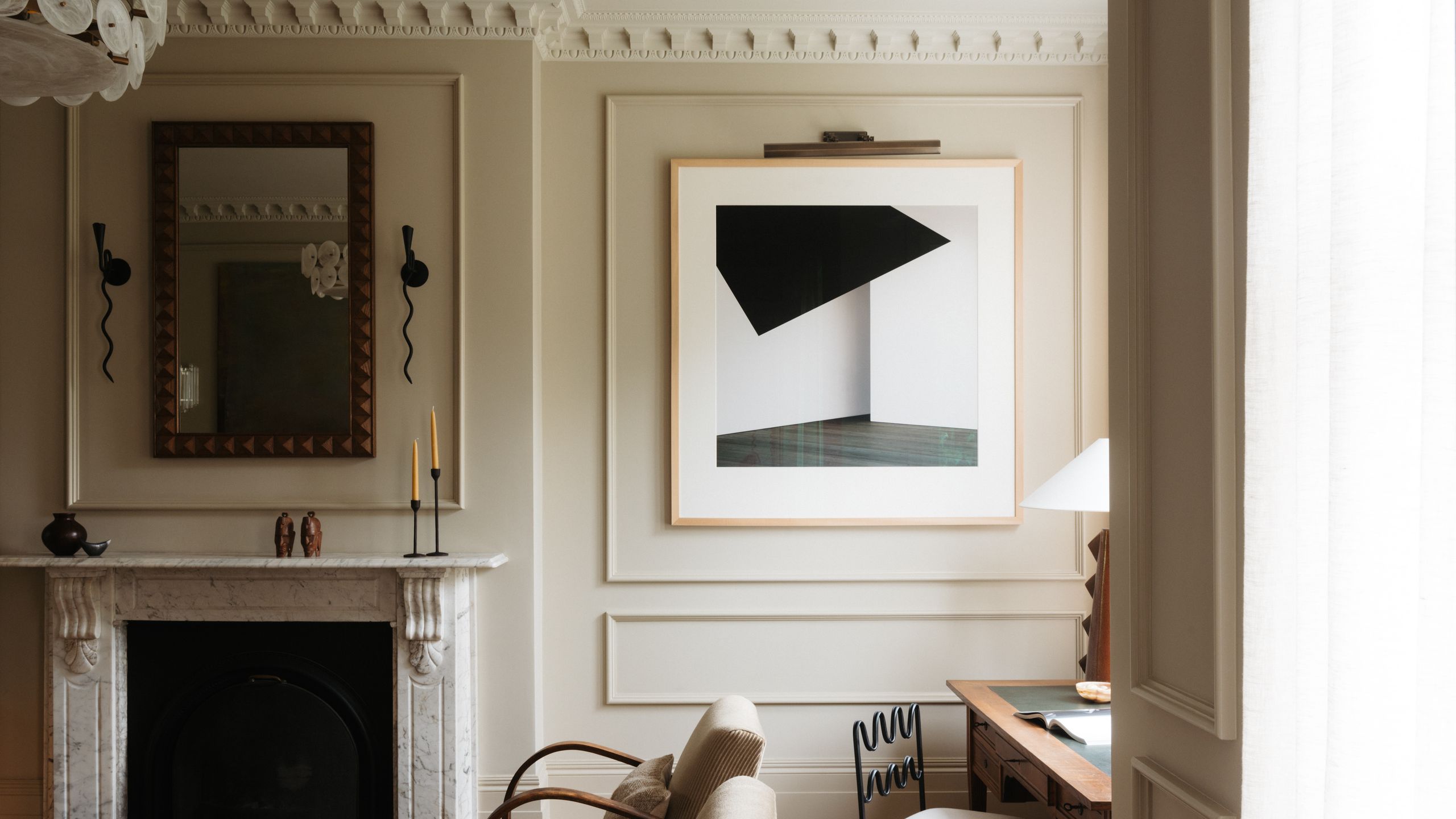 Image may contain: Indoors, Interior Design, Fireplace, Furniture, Table, Chair, Architecture, Building, and Living Room