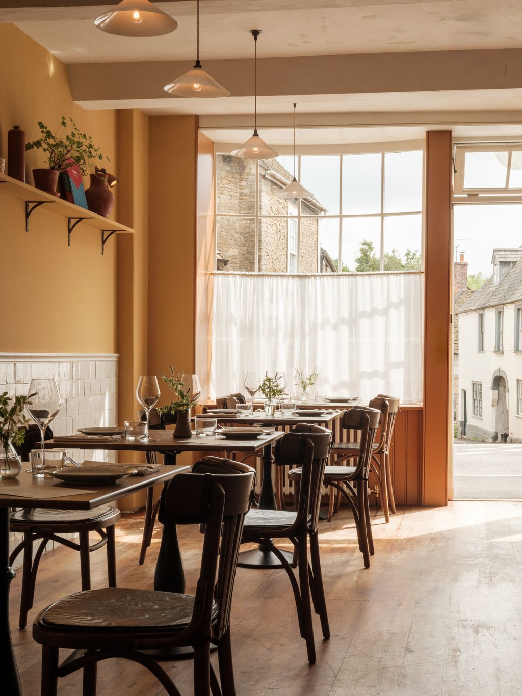 Image may contain Architecture Building Dining Room Dining Table Furniture Indoors Room Table and Restaurant